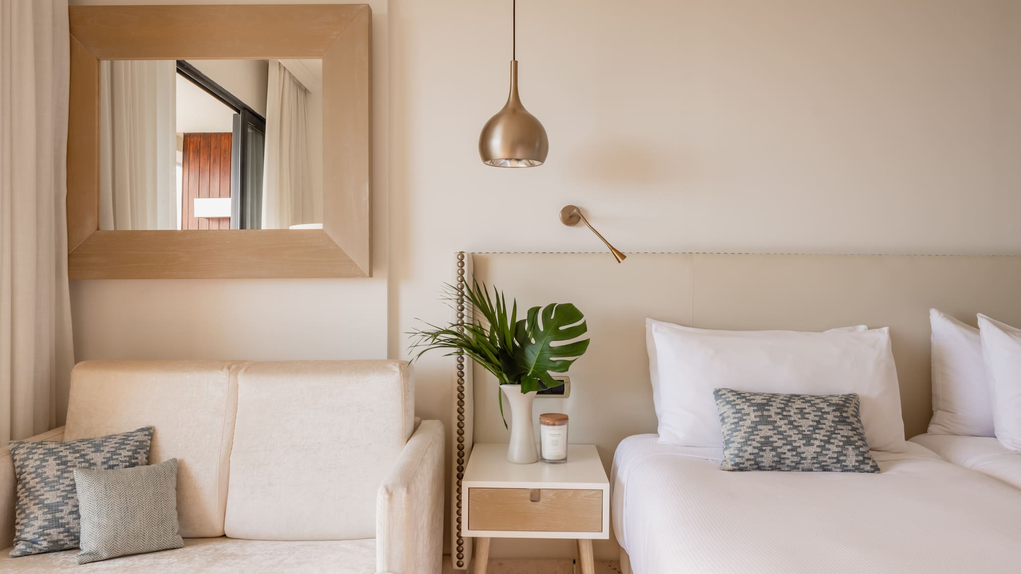 a bedroom with a bed and couch