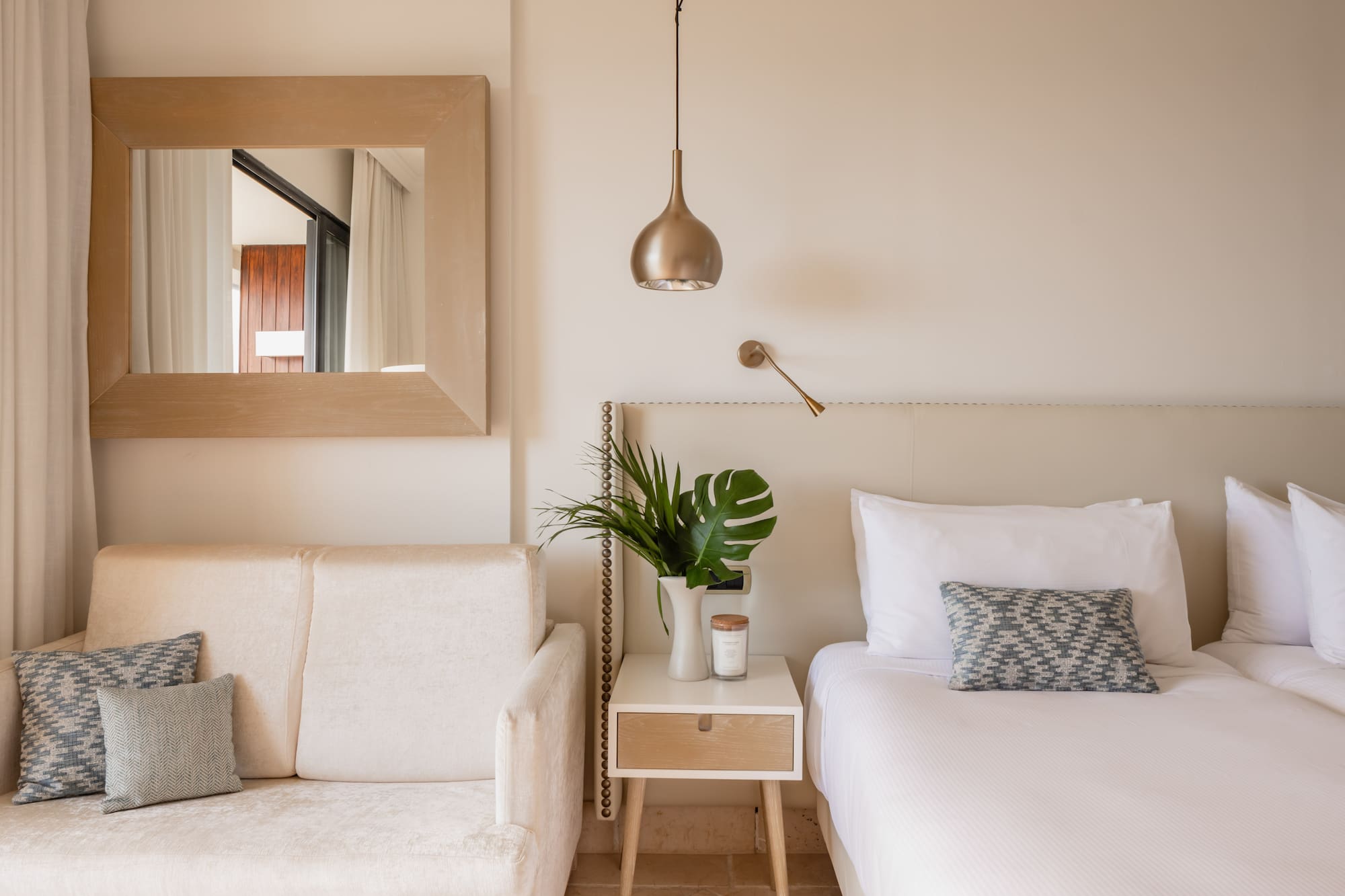 a bedroom with a bed and couch