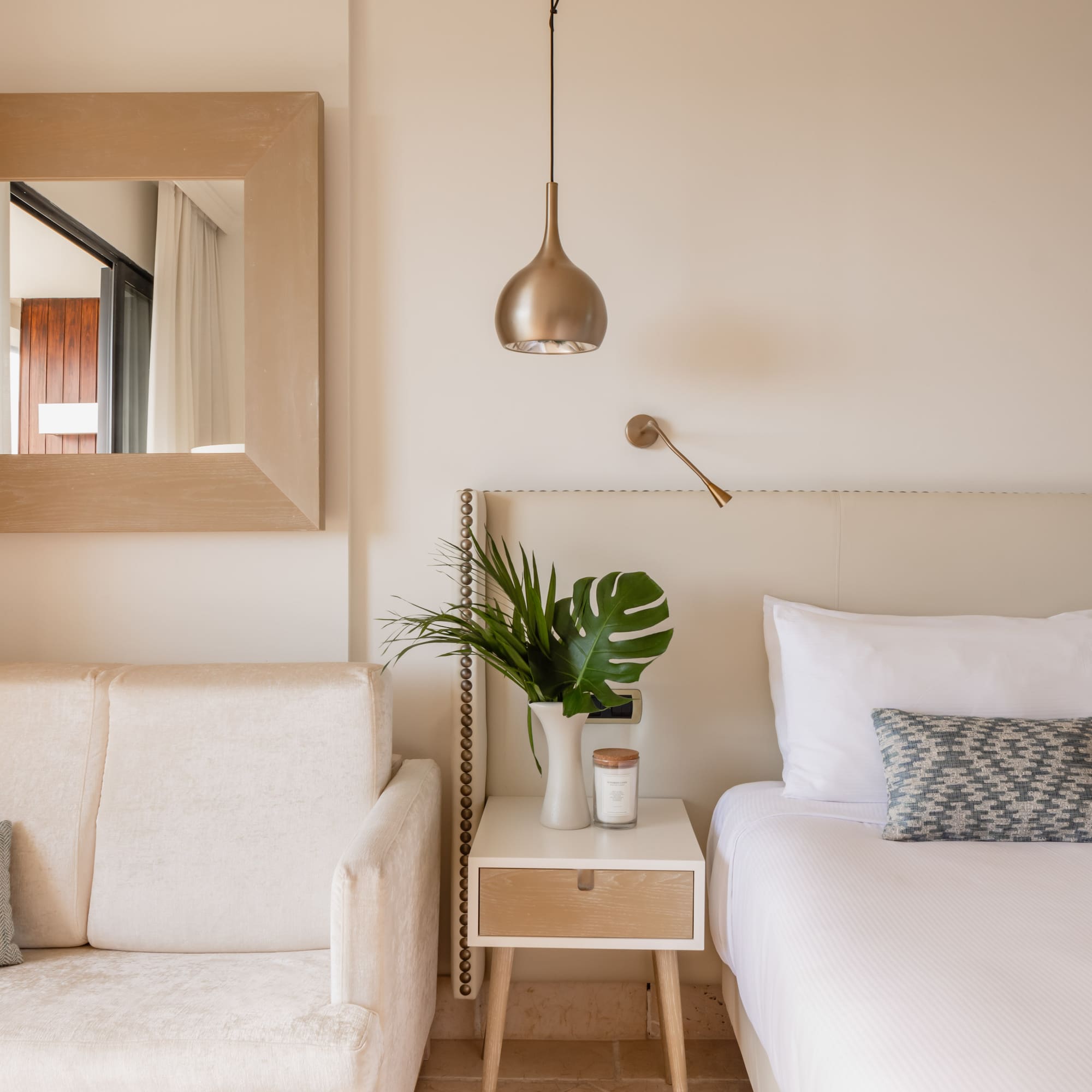 a bedroom with a bed and couch