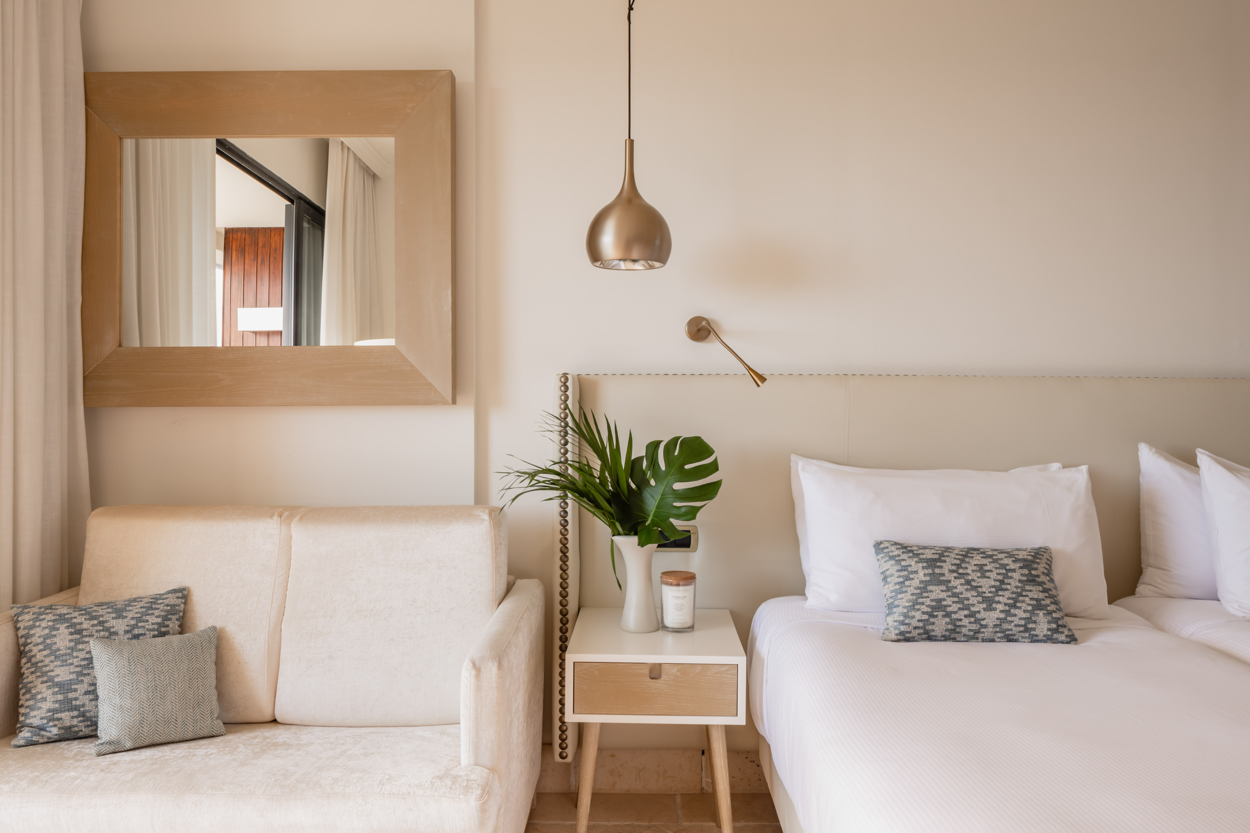 a bedroom with a bed and couch