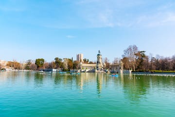 a body of water with a building and boats in it