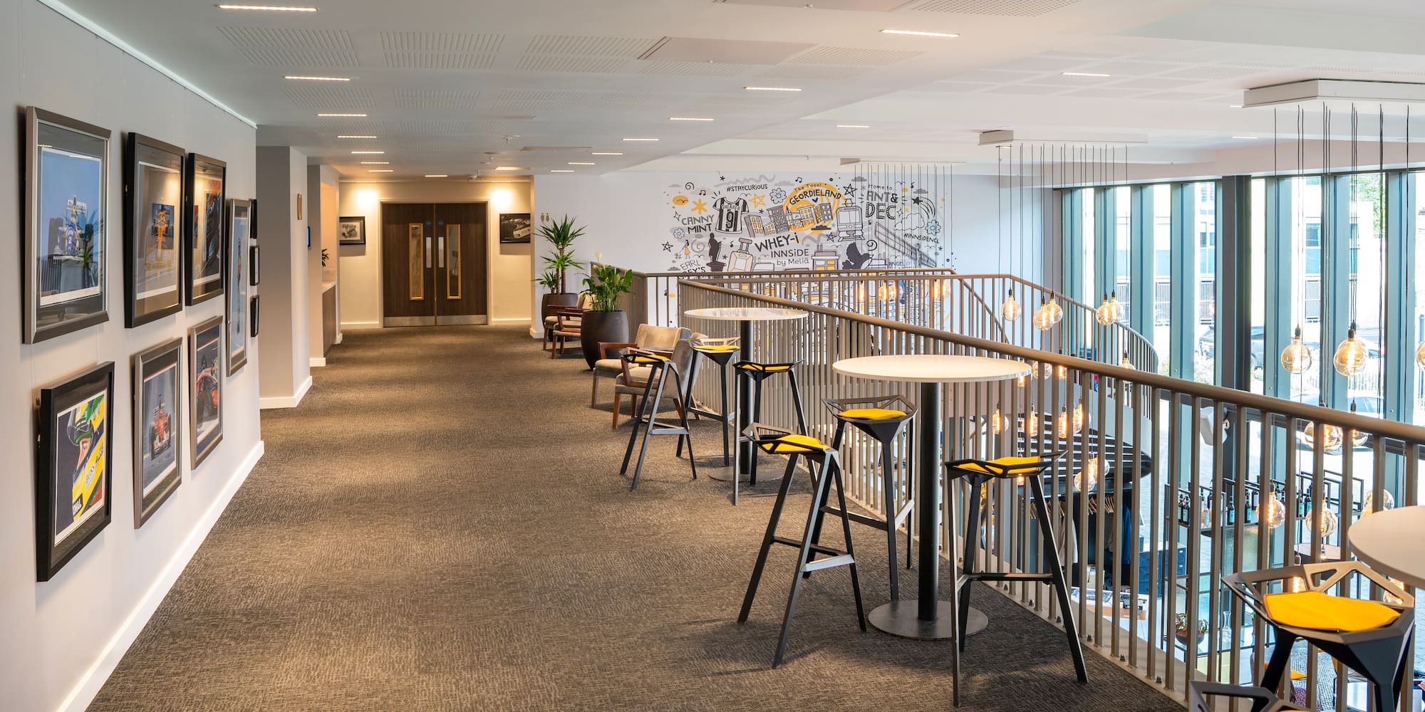 a long hallway with chairs and tables
