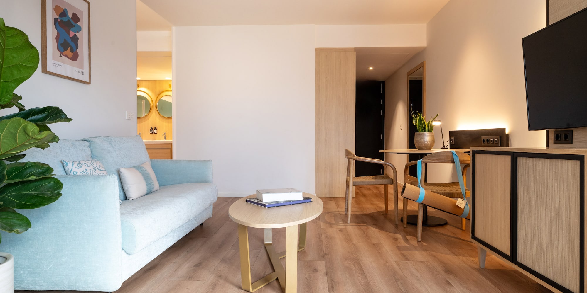 a bathroom with a tub and a glass door