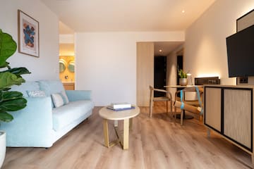 a living room with a couch and a table