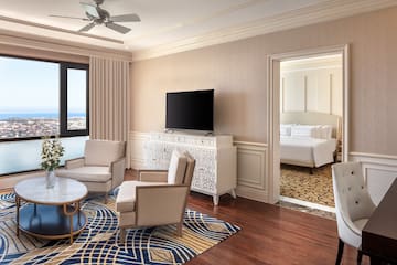 a room with a television and a bed