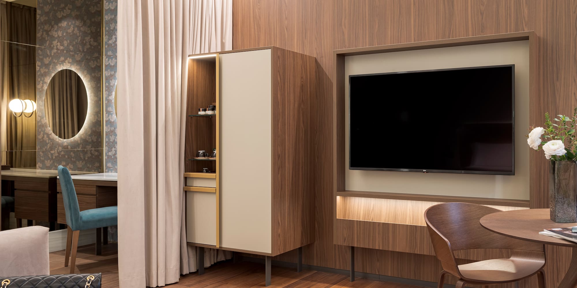 a room with a tv and a chair