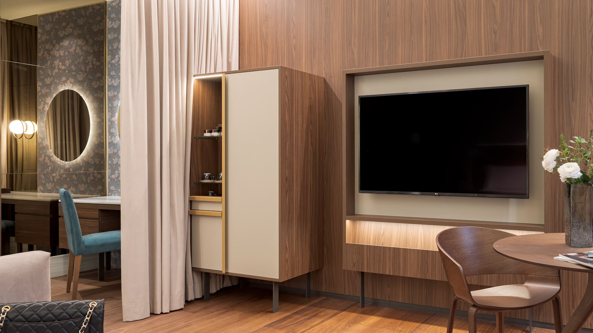 a room with a tv and a chair