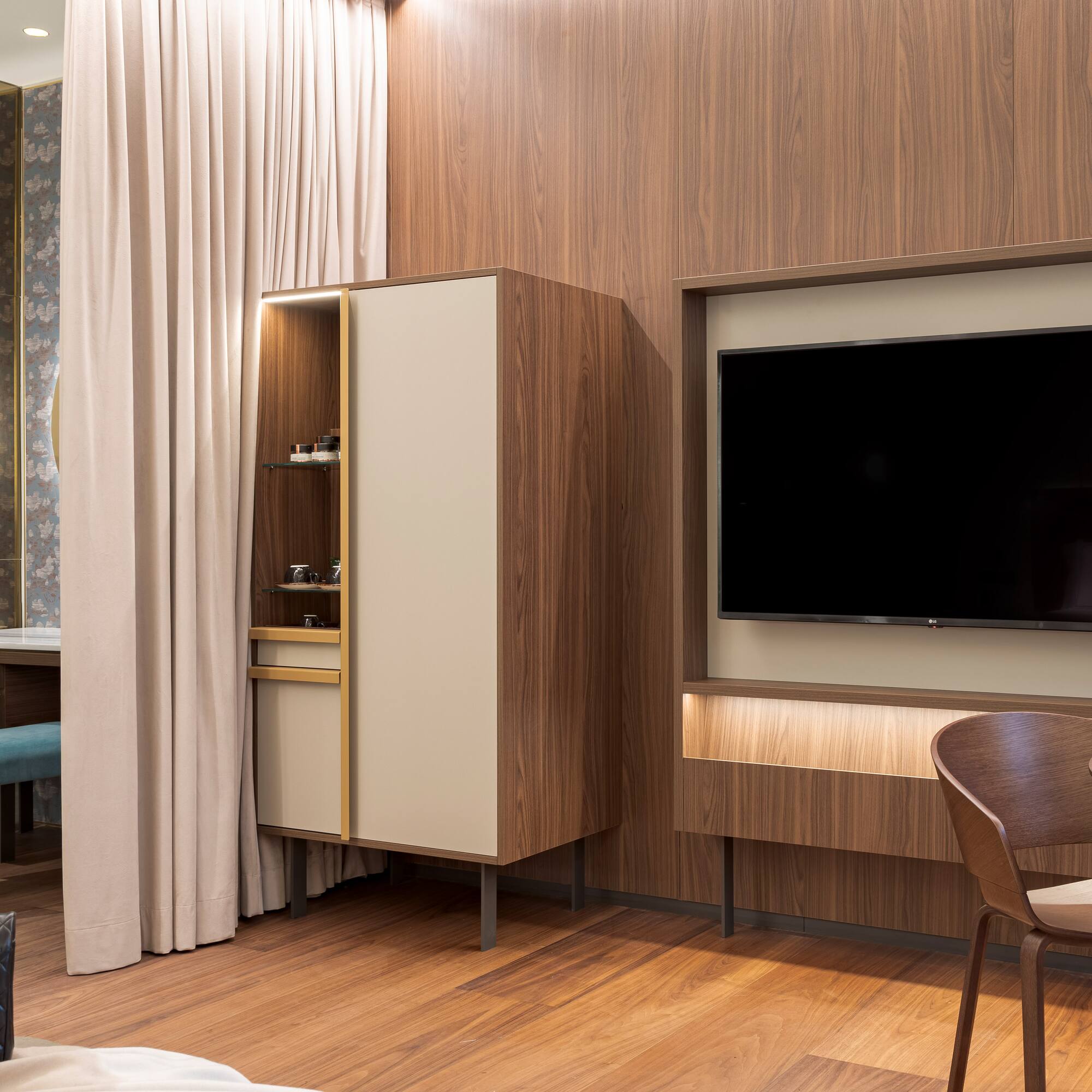 a room with a tv and a chair