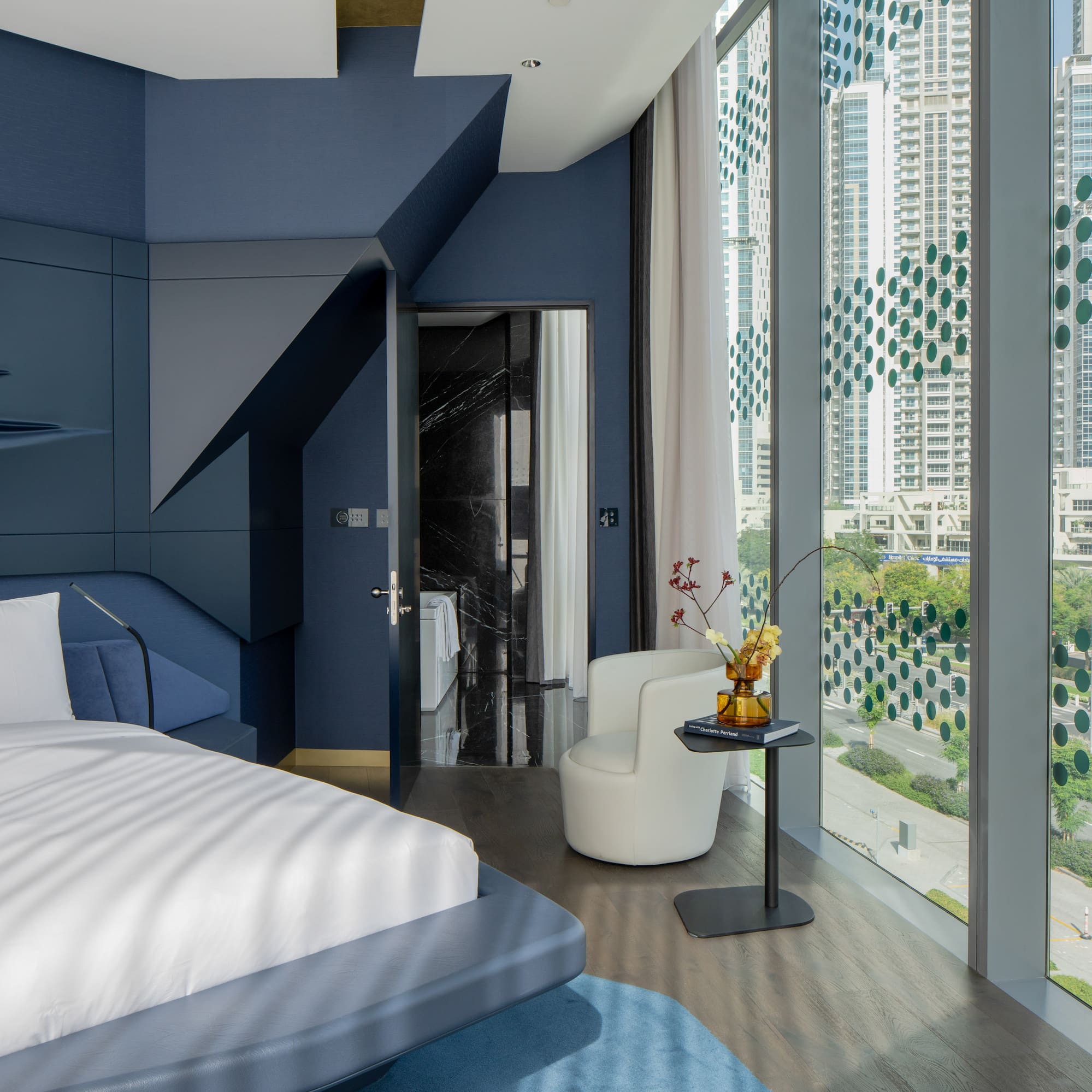 a room with a bed and a chair