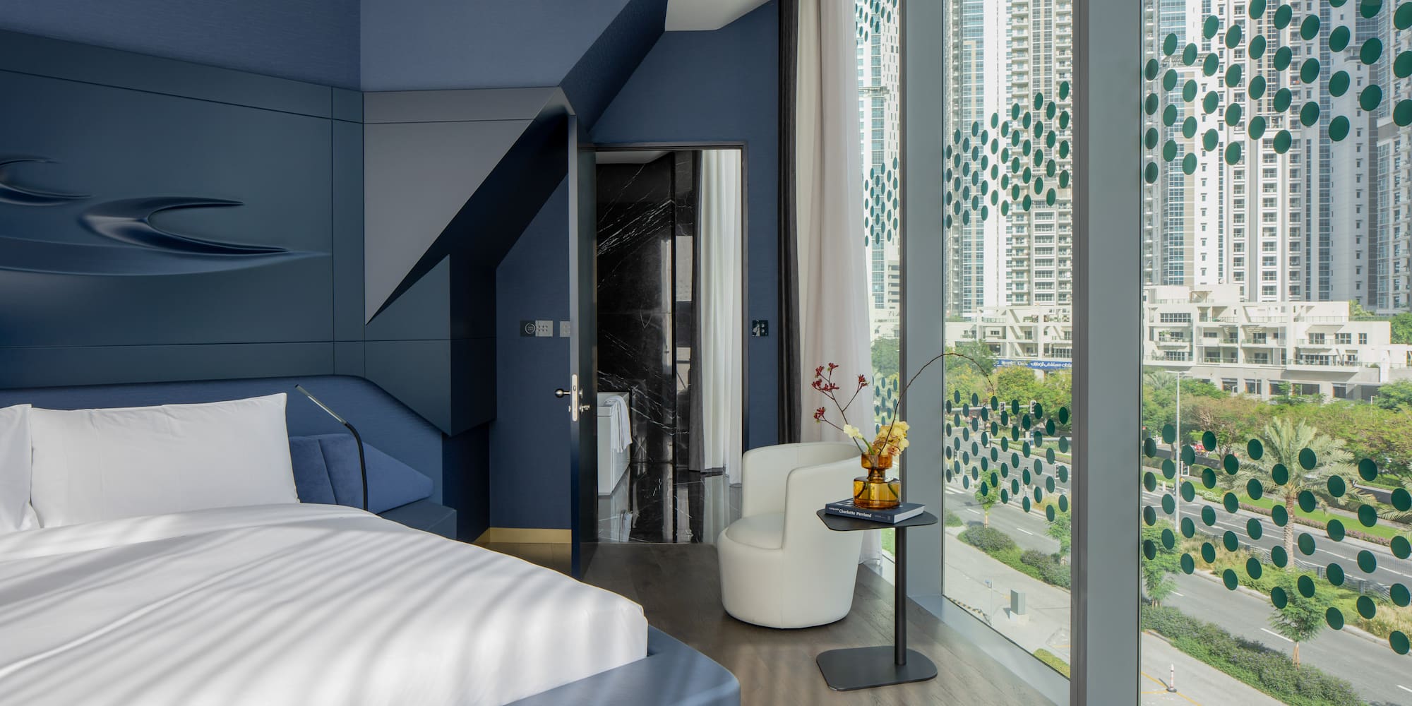 a room with a bed and a chair