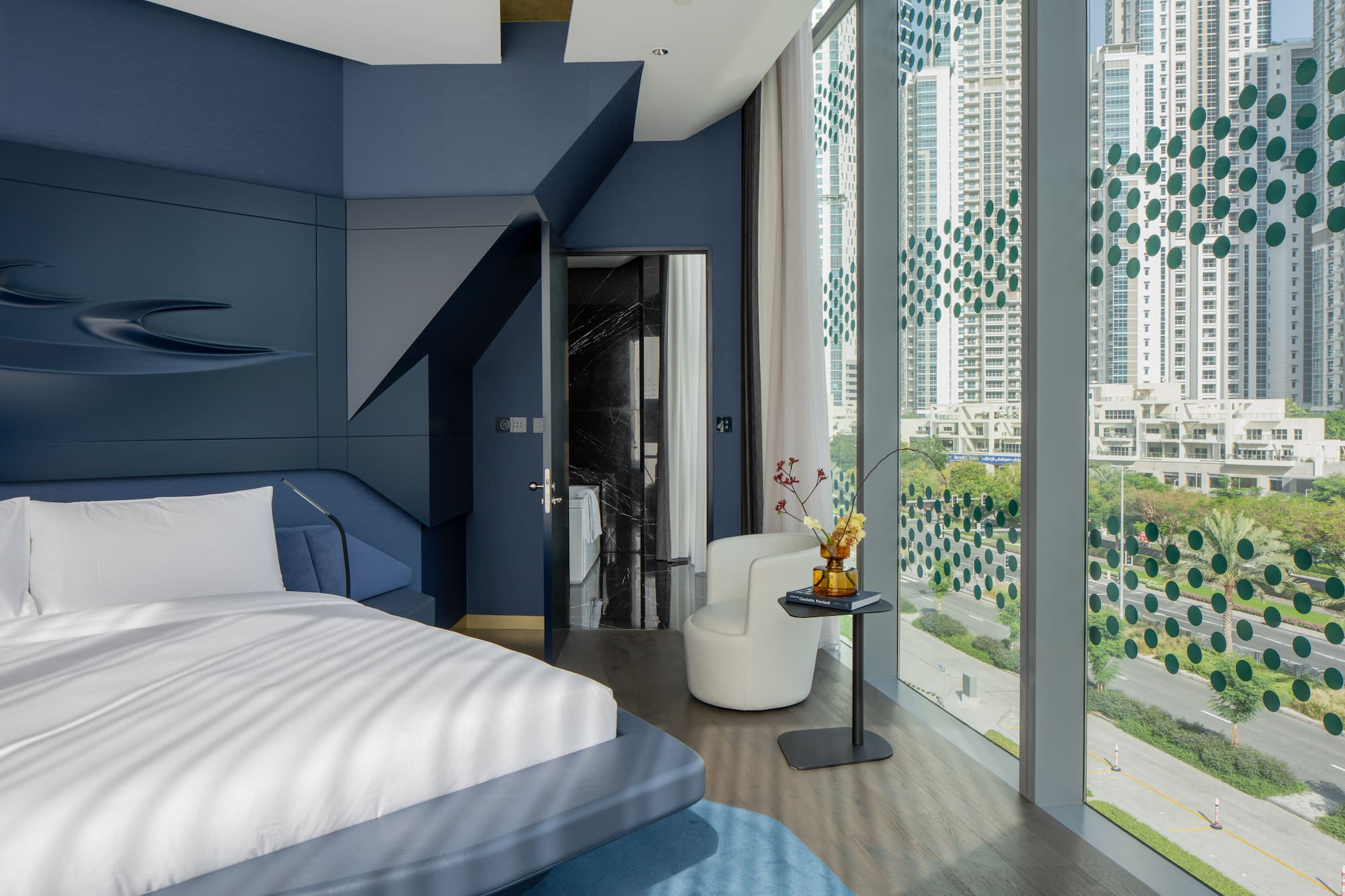 a room with a bed and a chair