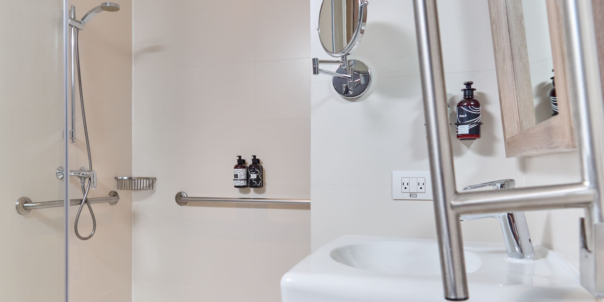 a bathroom with a shower and a mirror