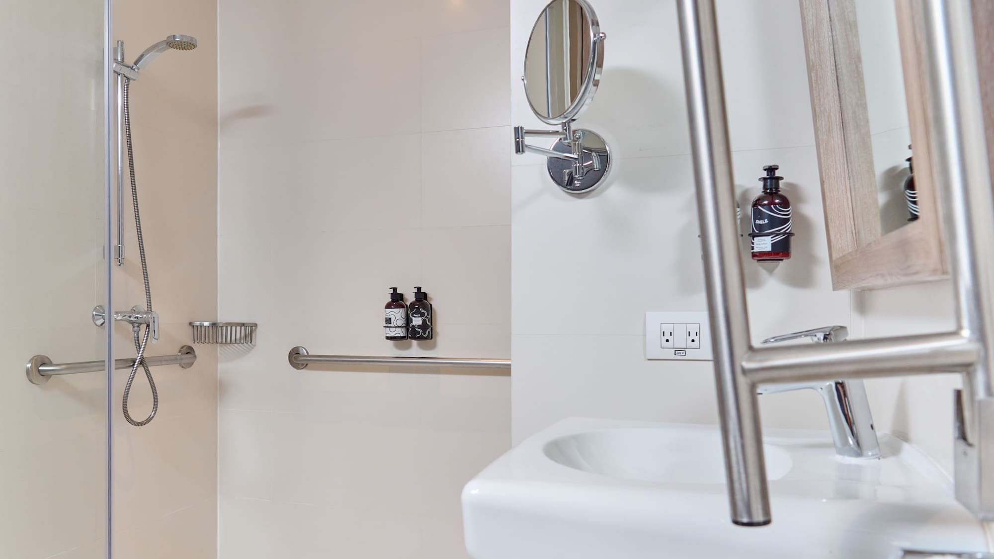 a bathroom with a shower and a mirror