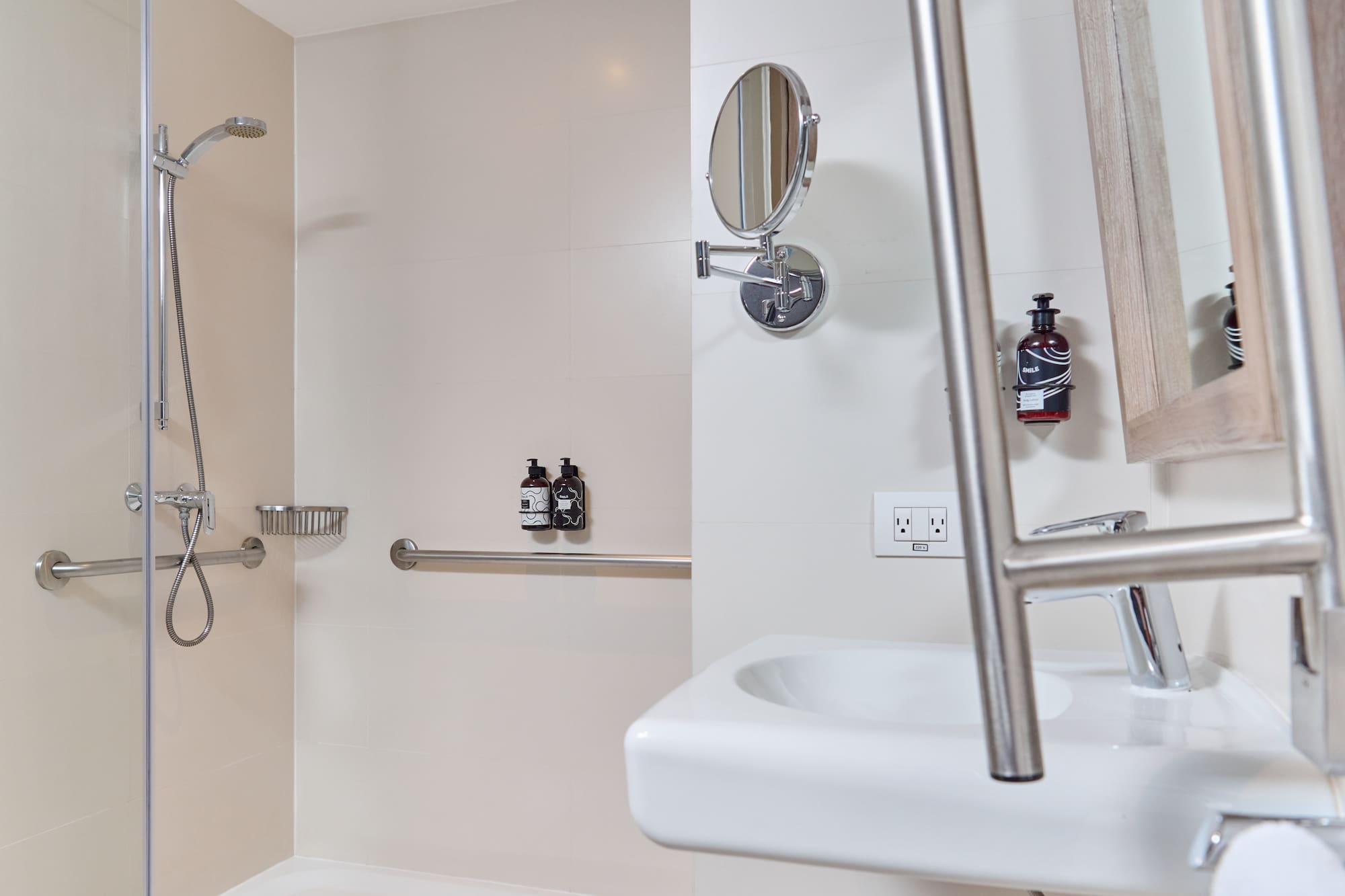 a bathroom with a shower and a mirror