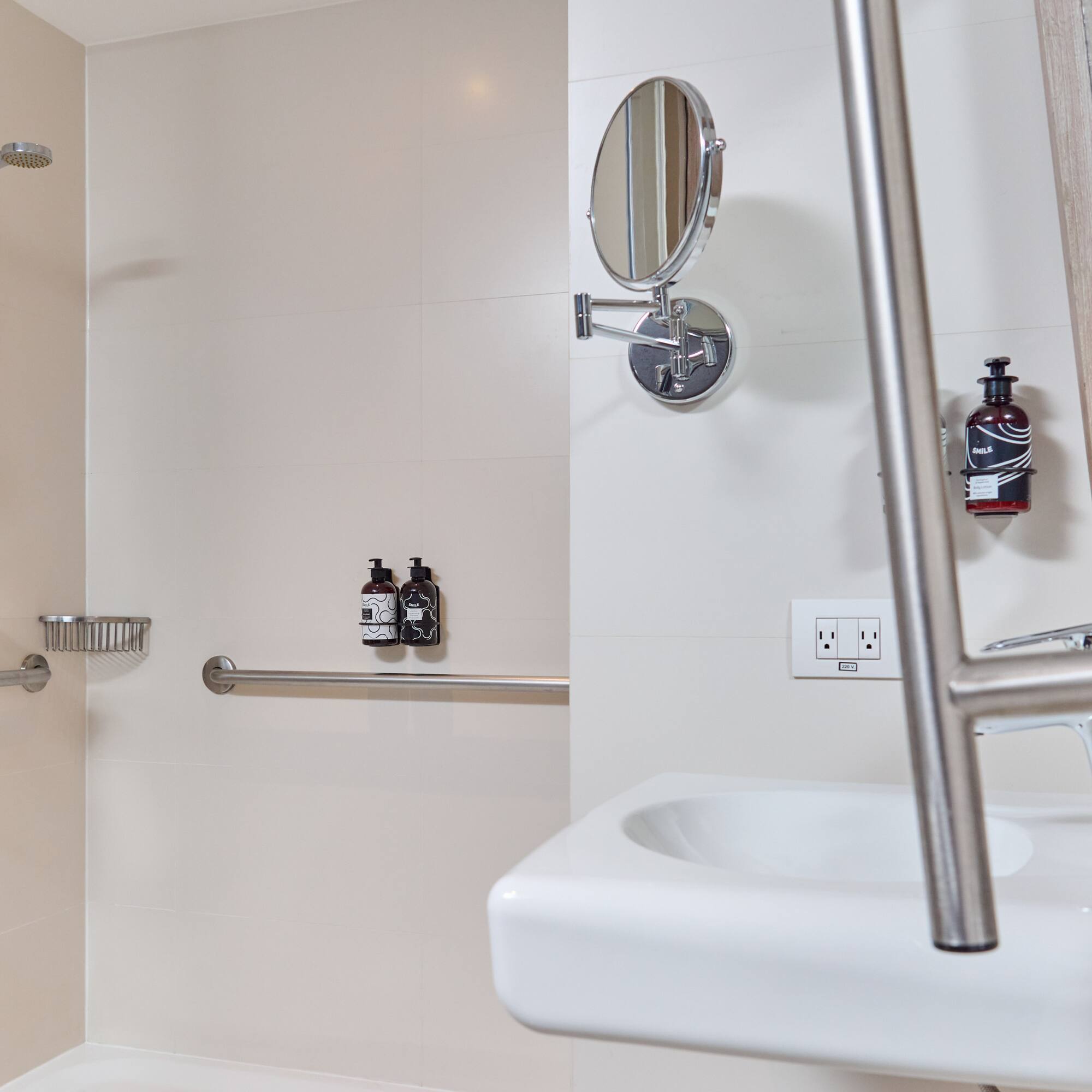 a bathroom with a shower and a mirror