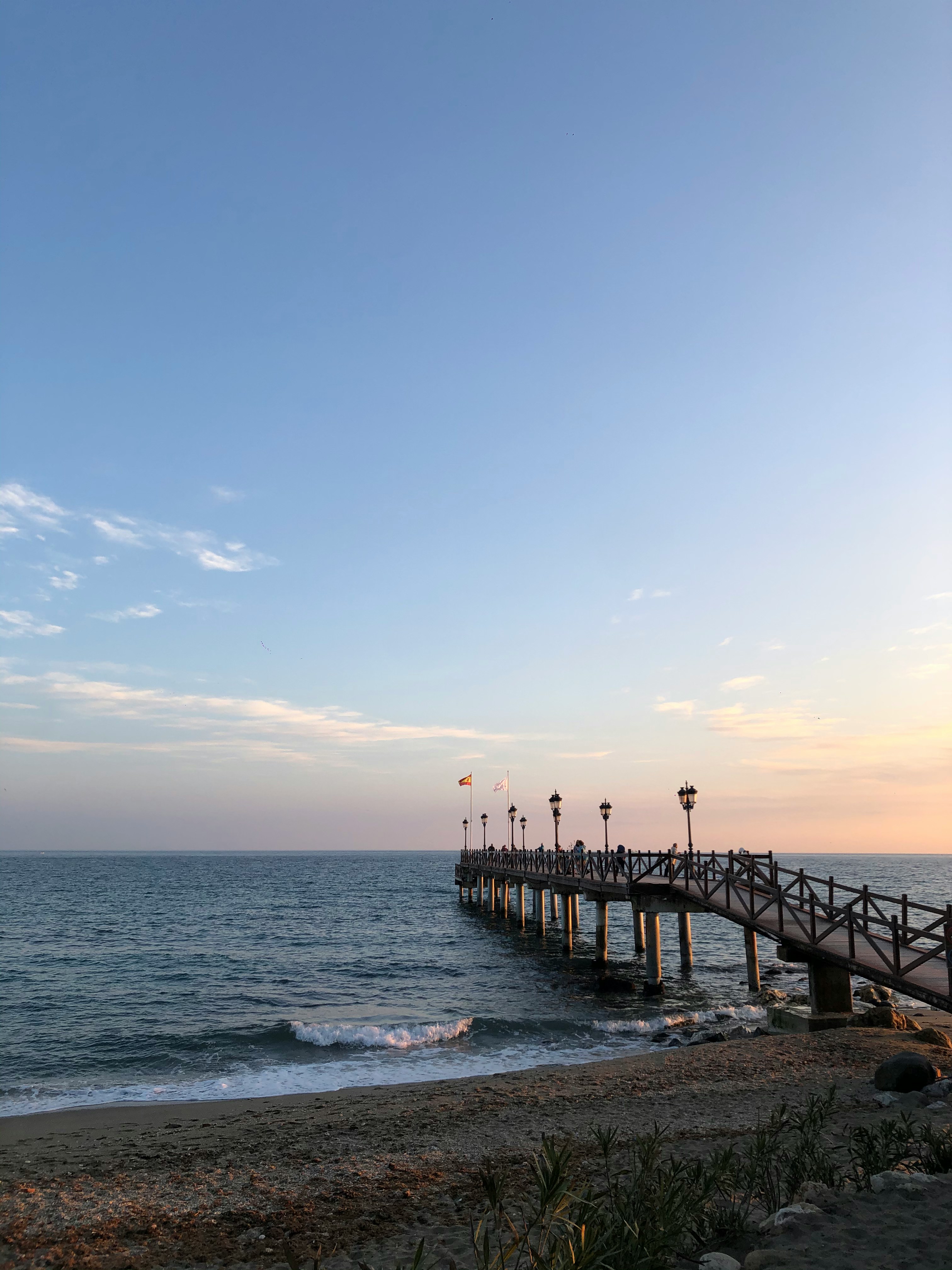 a pier with people walking on it