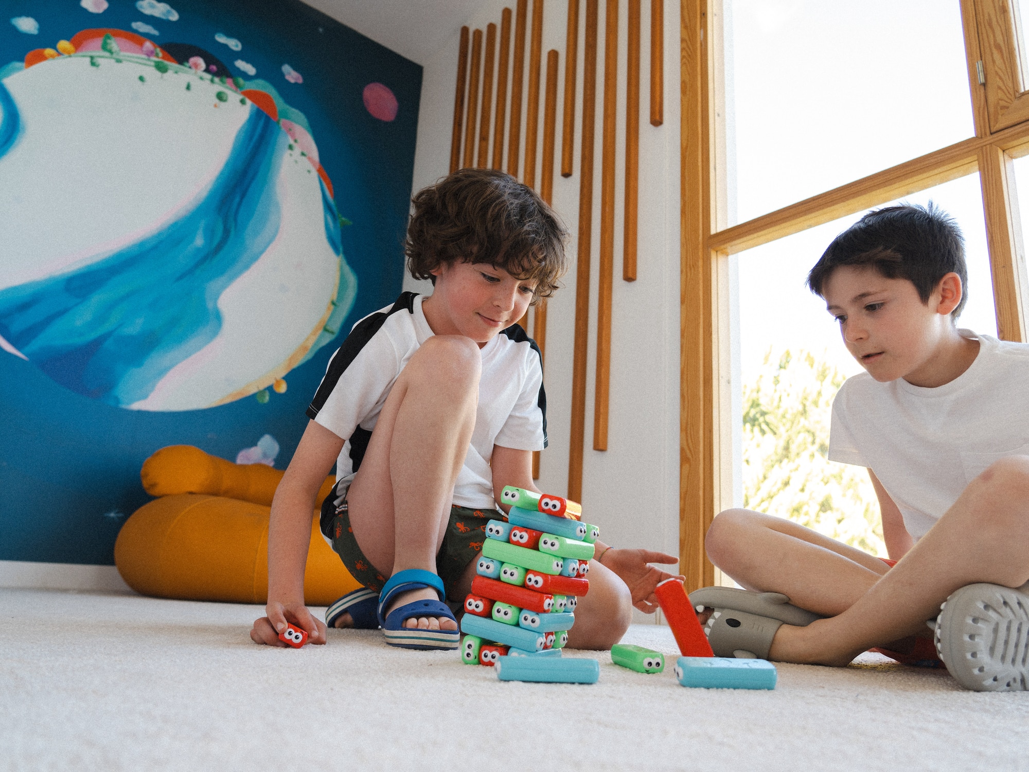 two boys playing with toys