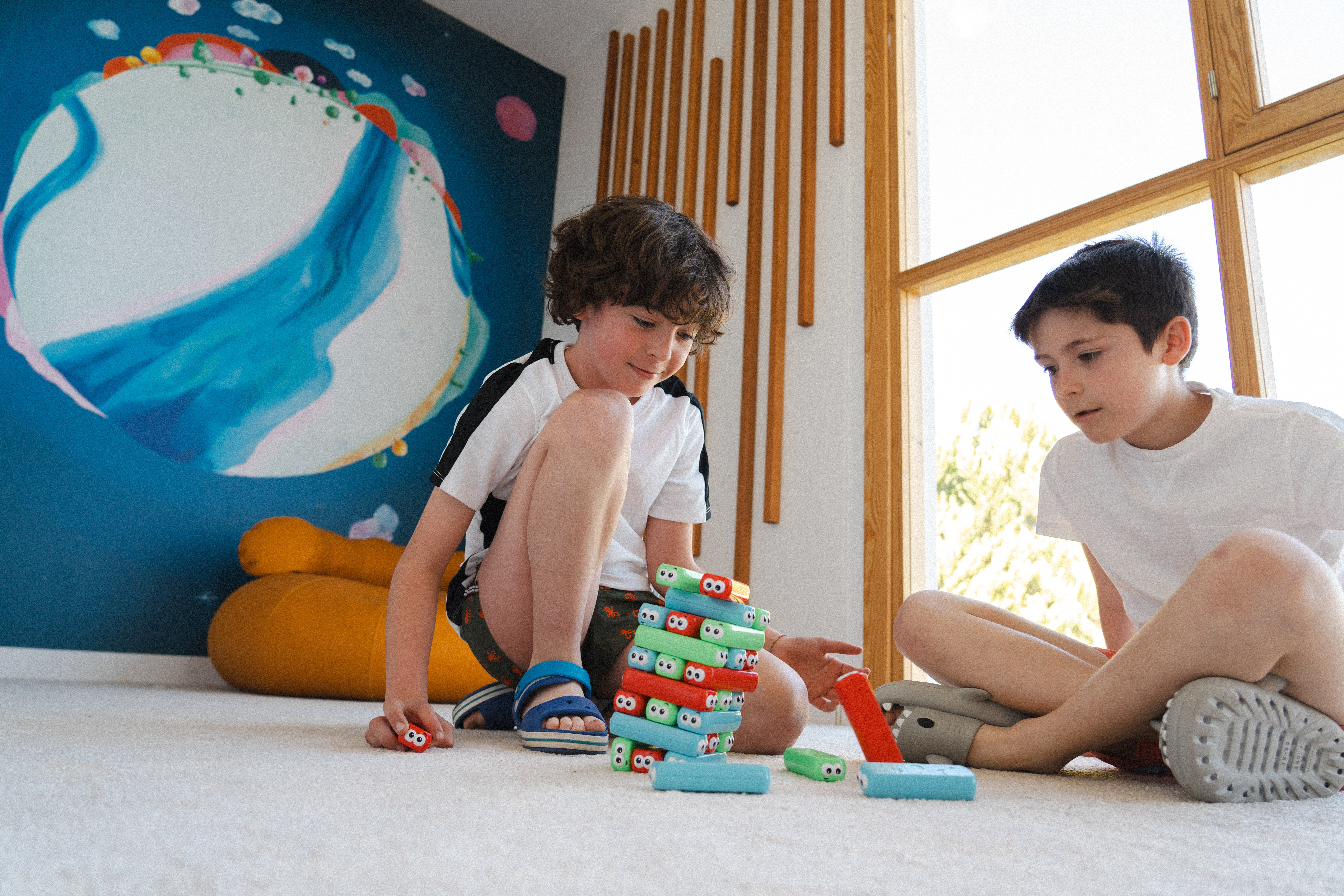 two boys playing with toys