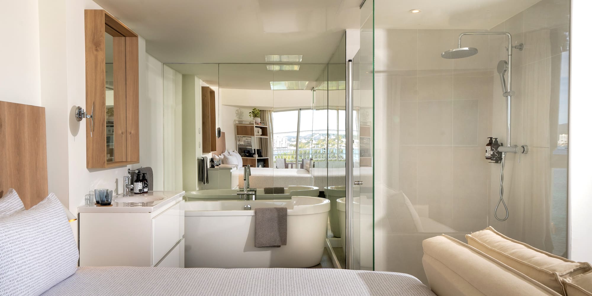 a bathroom with a large mirror and a bathtub