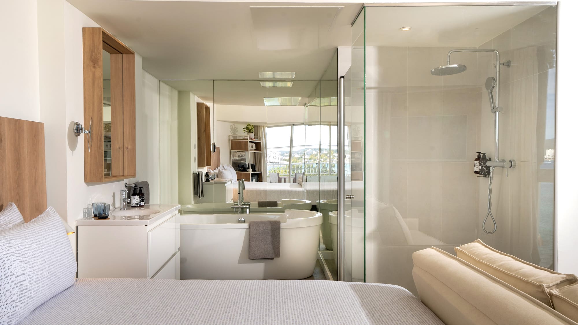 a bathroom with a large mirror and a bathtub