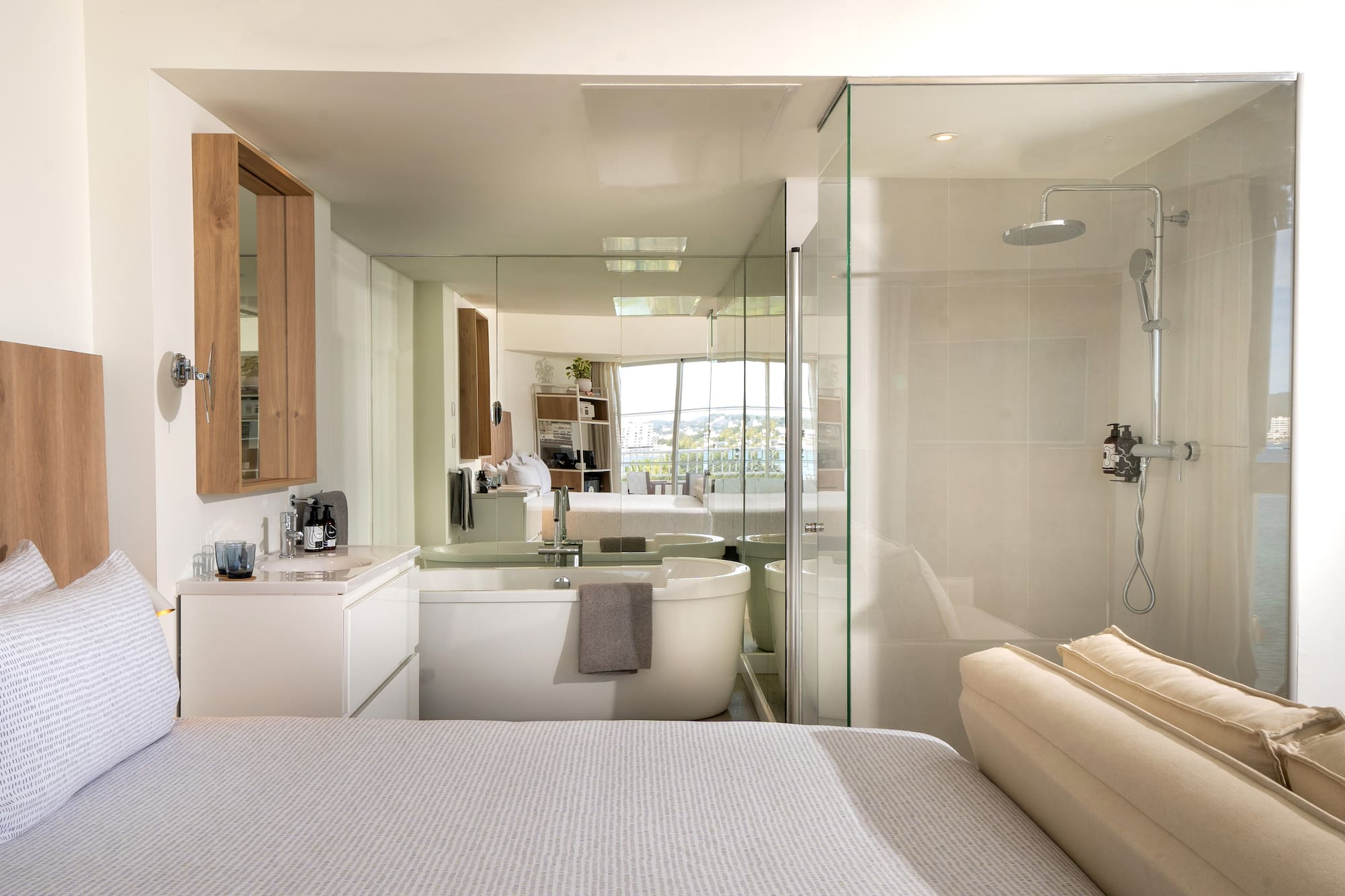 a bathroom with a large mirror and a bathtub