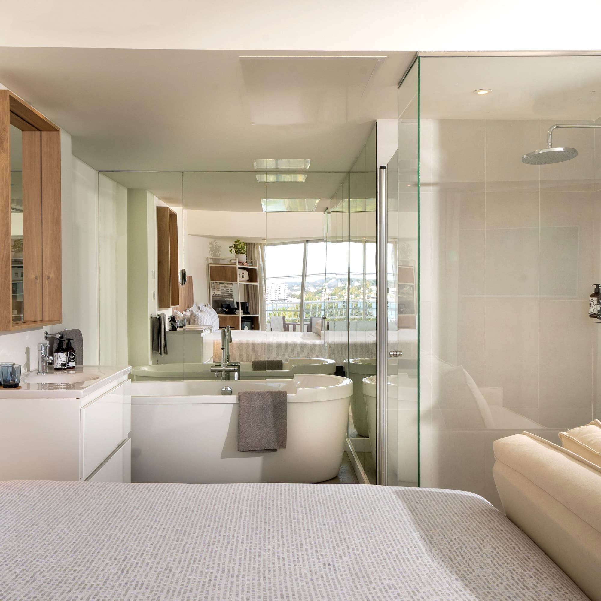 a bathroom with a large mirror and a bathtub