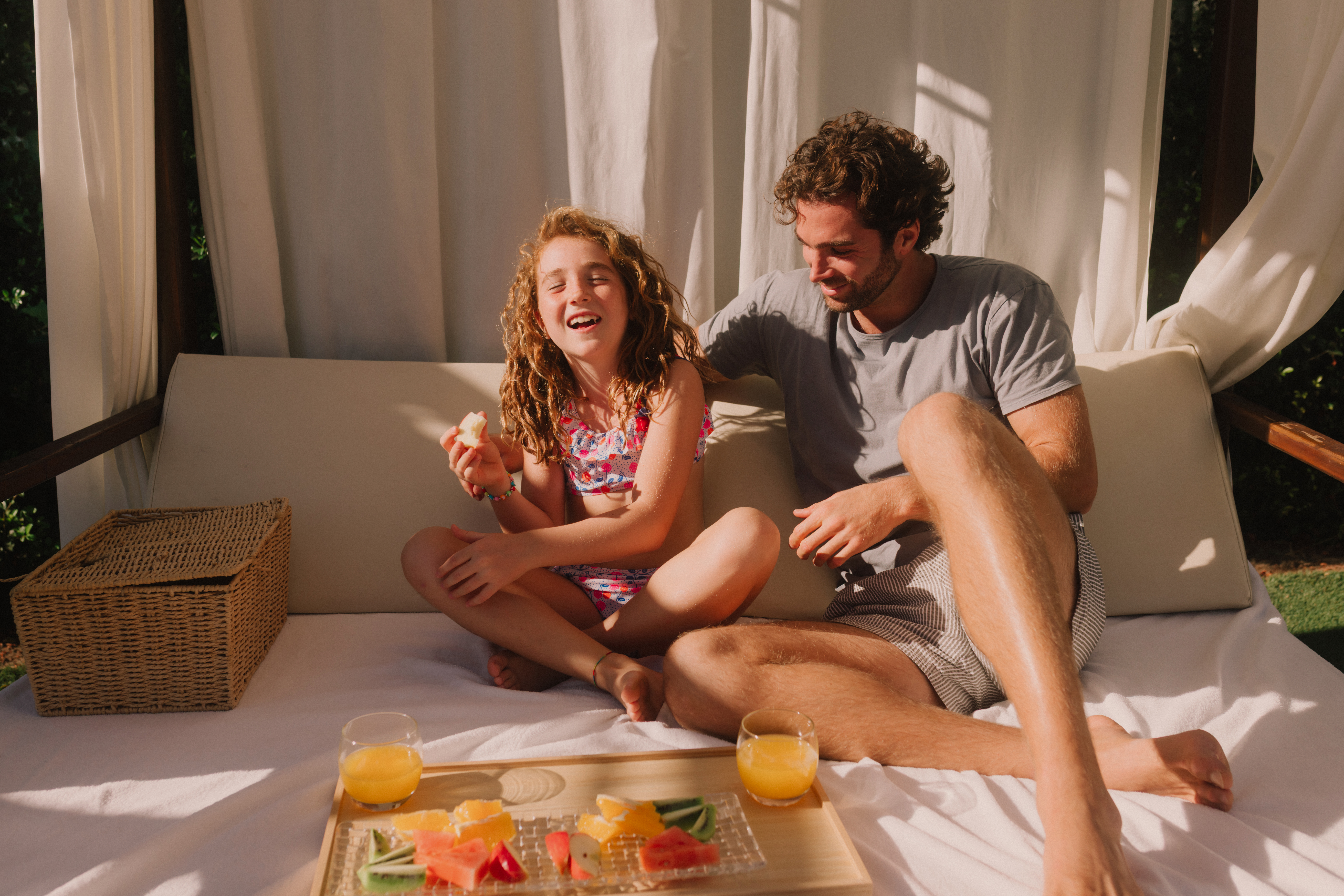 a man and girl sitting on a couch