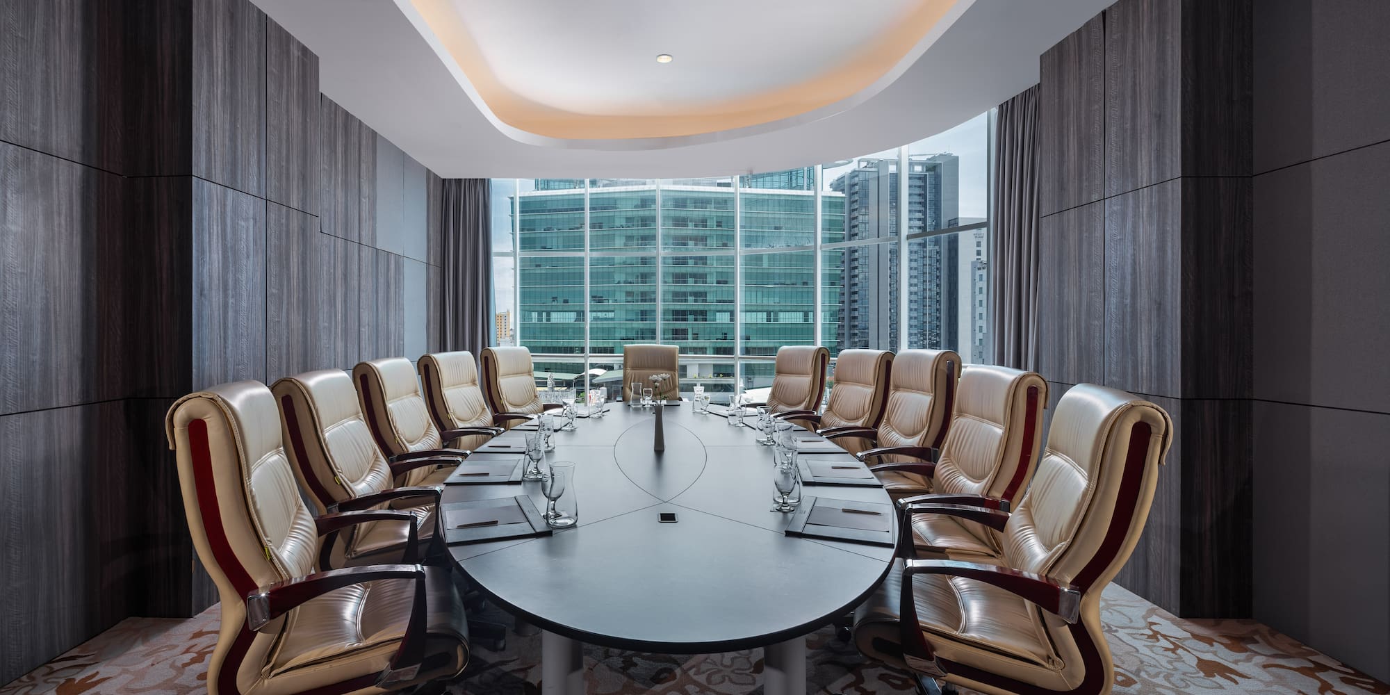 a conference room with a table and chairs
