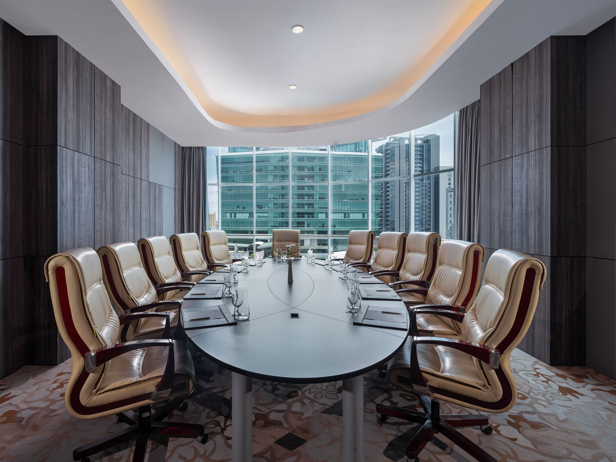 a conference room with a table and chairs