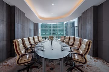 a conference room with a table and chairs