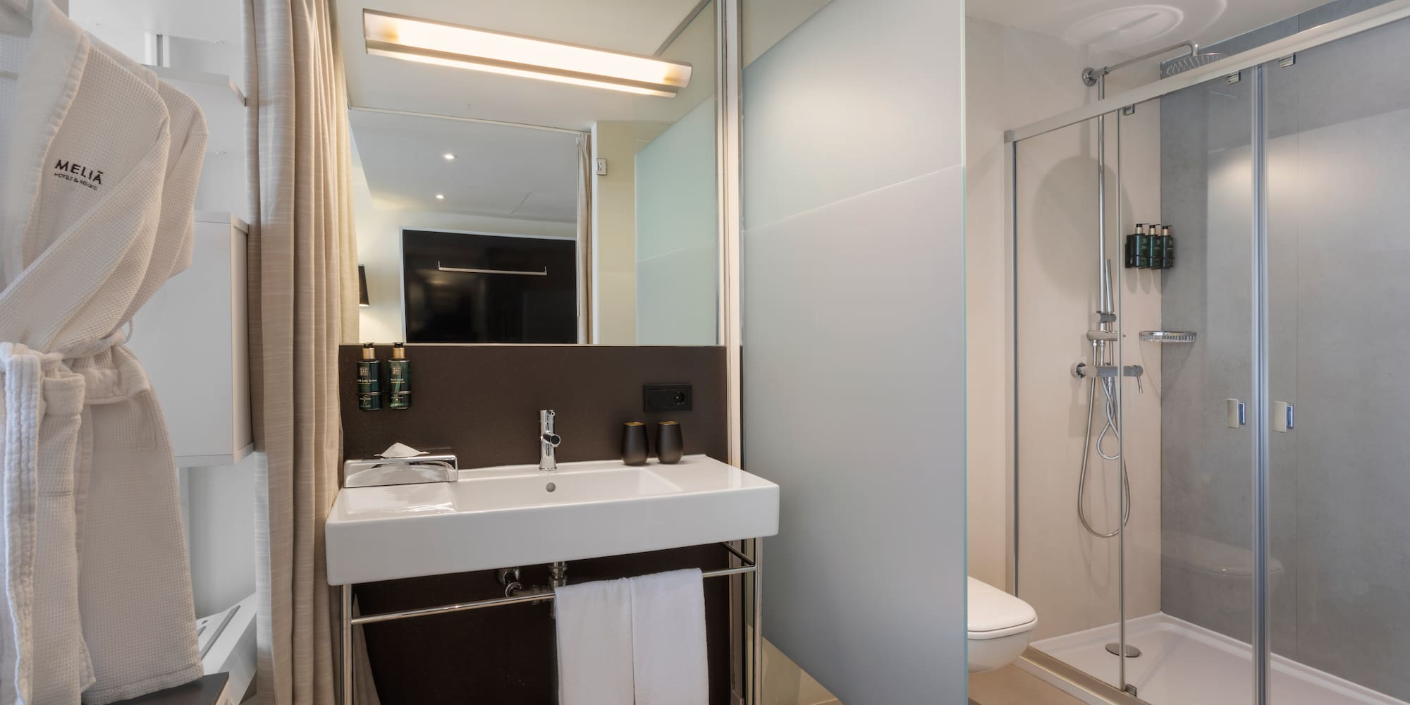 a bathroom with a shower and sink