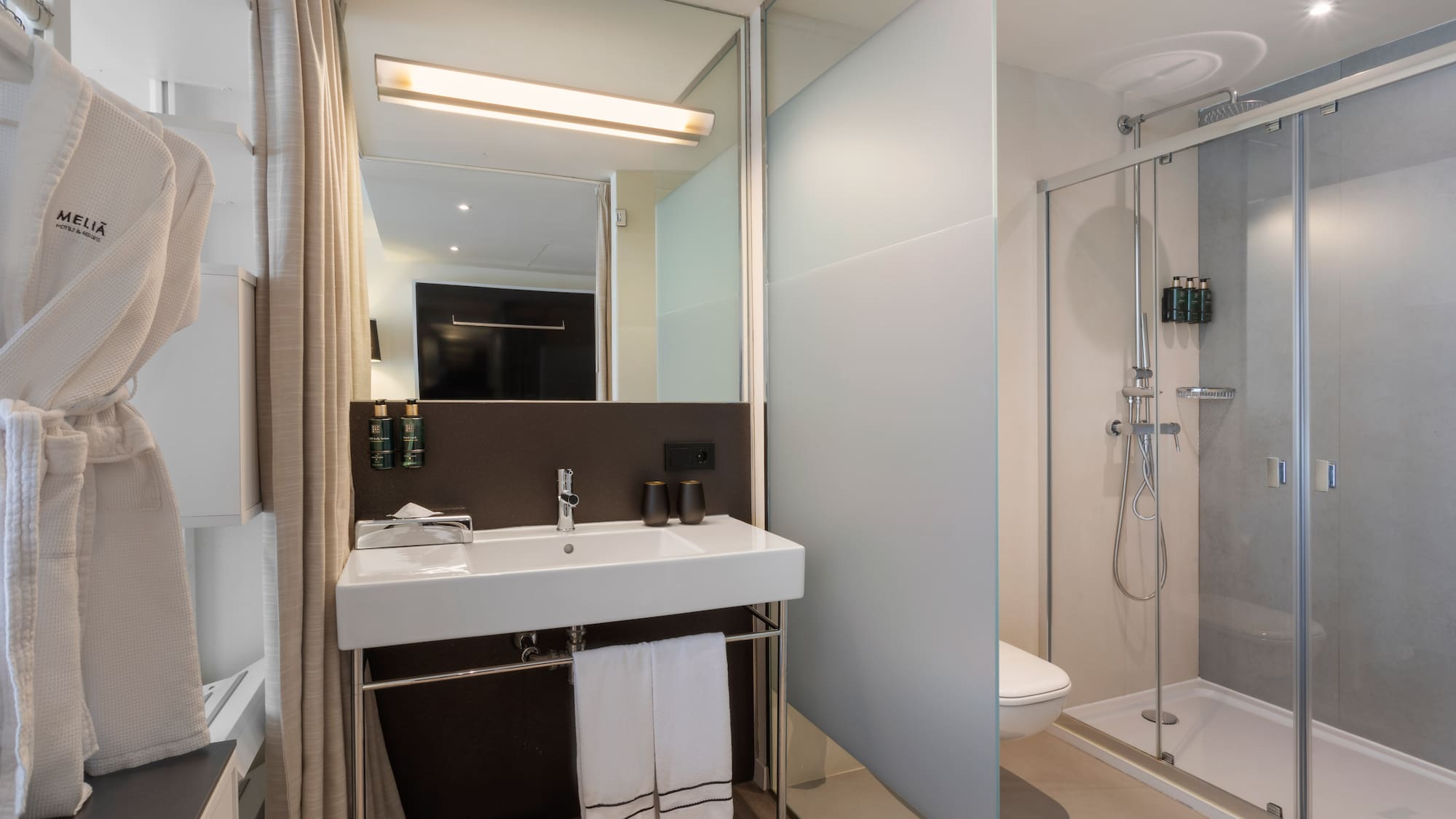 a bathroom with a shower and sink