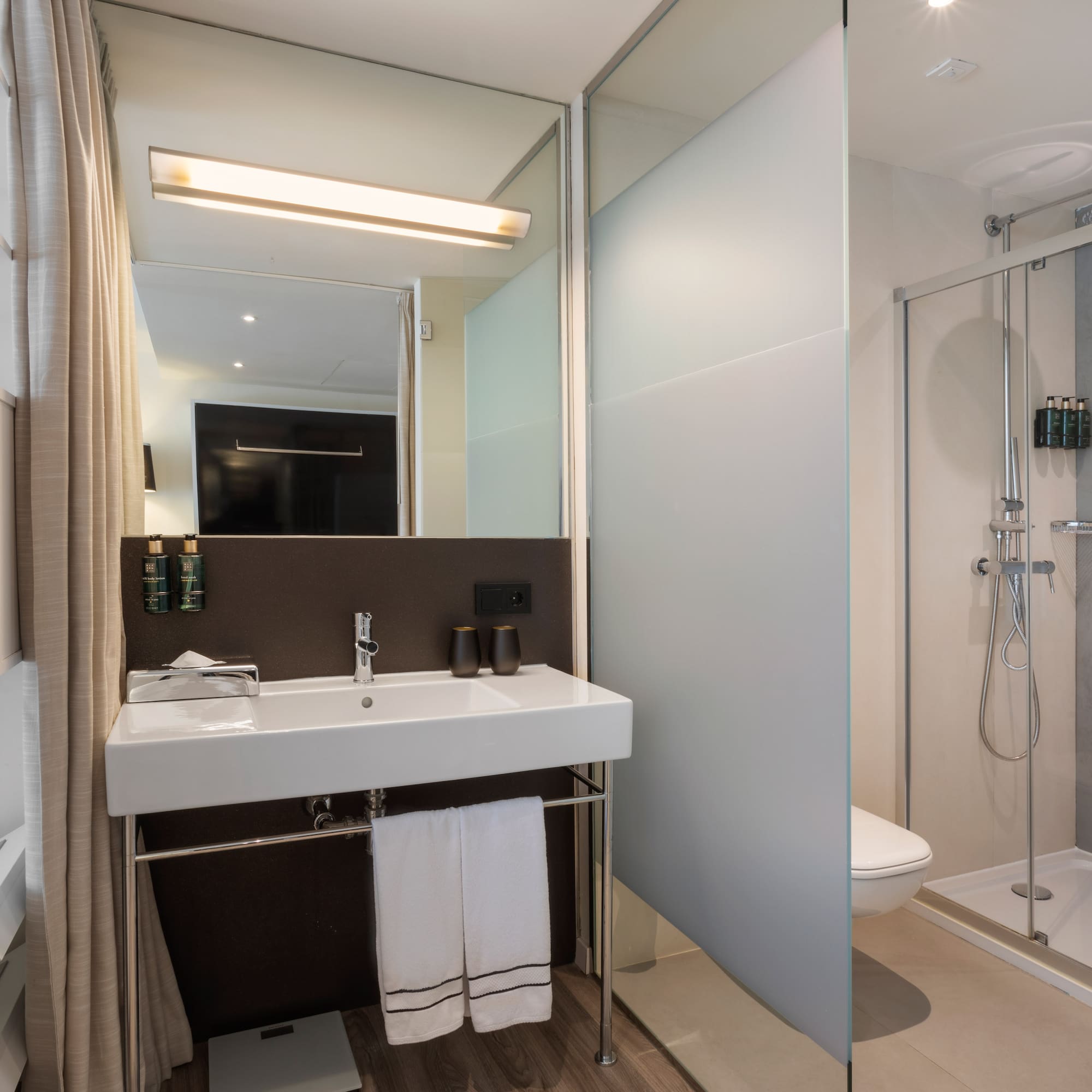 a bathroom with a shower and sink