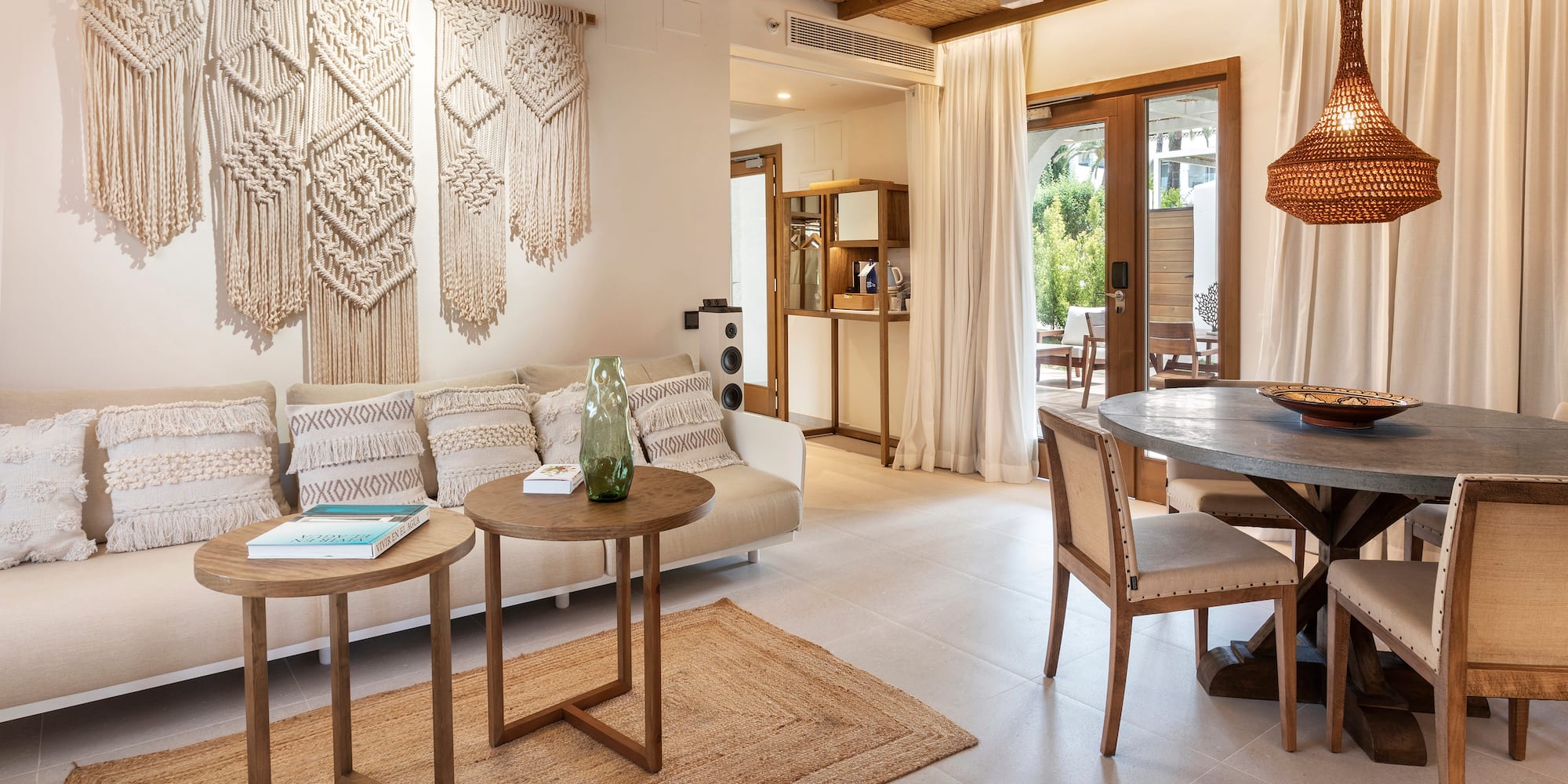 a living room with a table and chairs