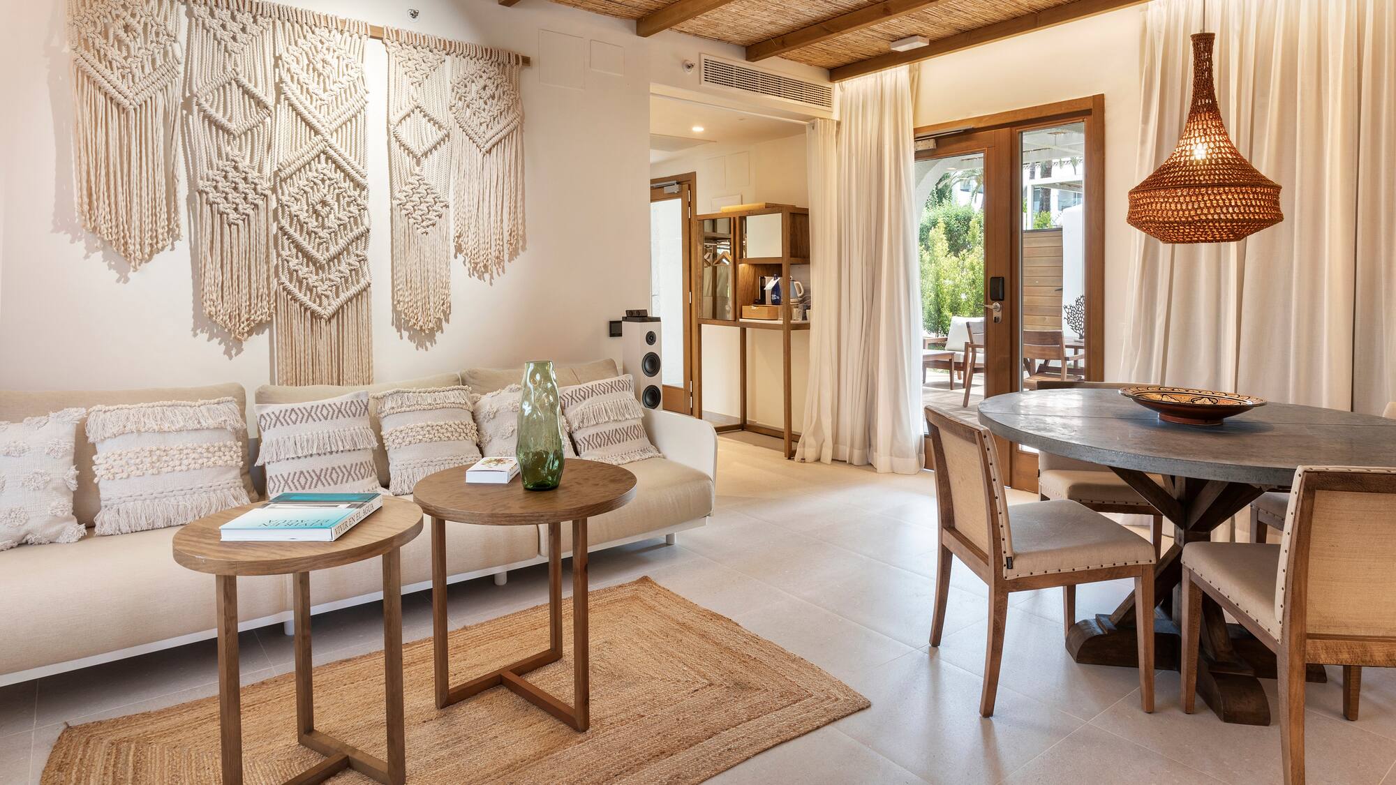 a living room with a table and chairs