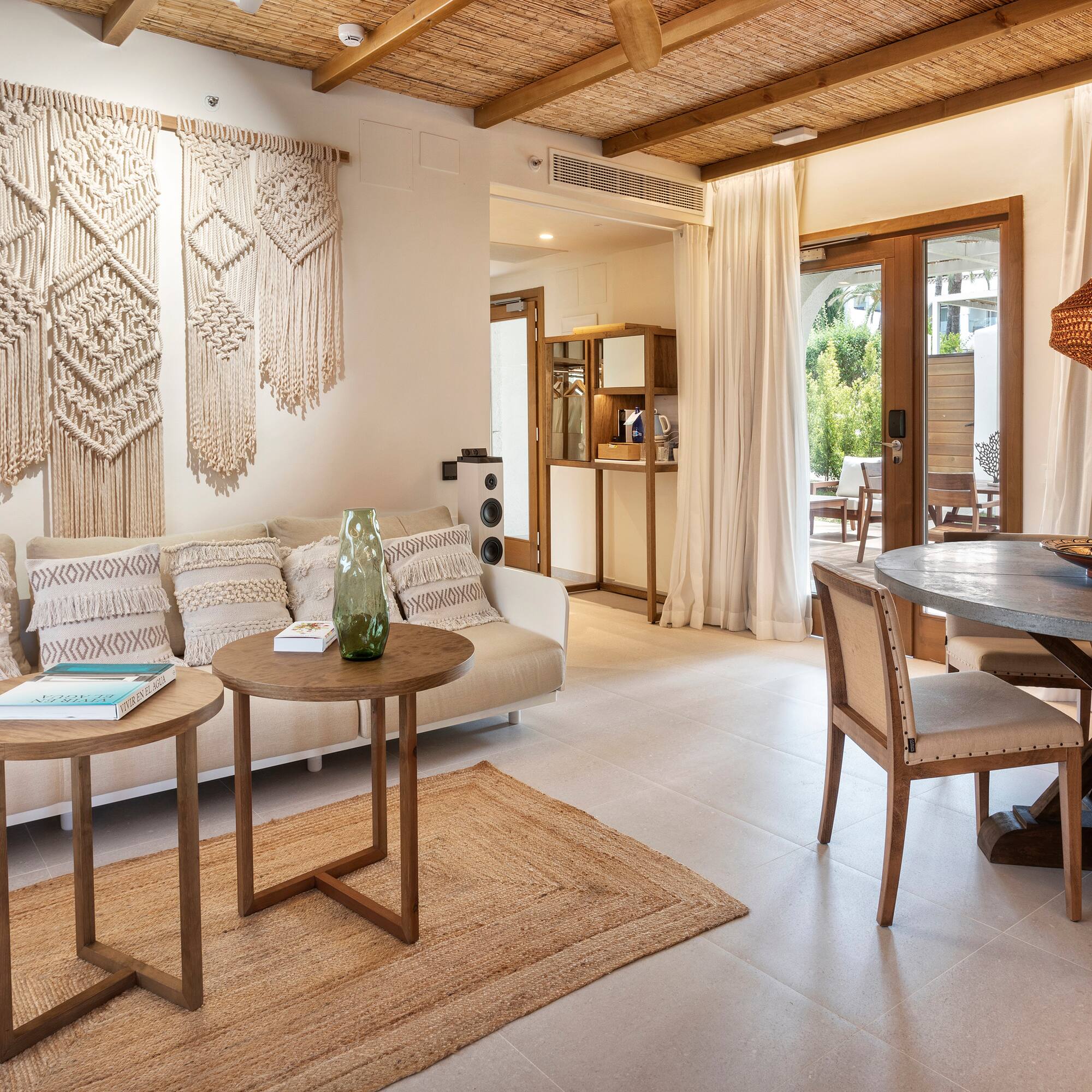 a living room with a table and chairs