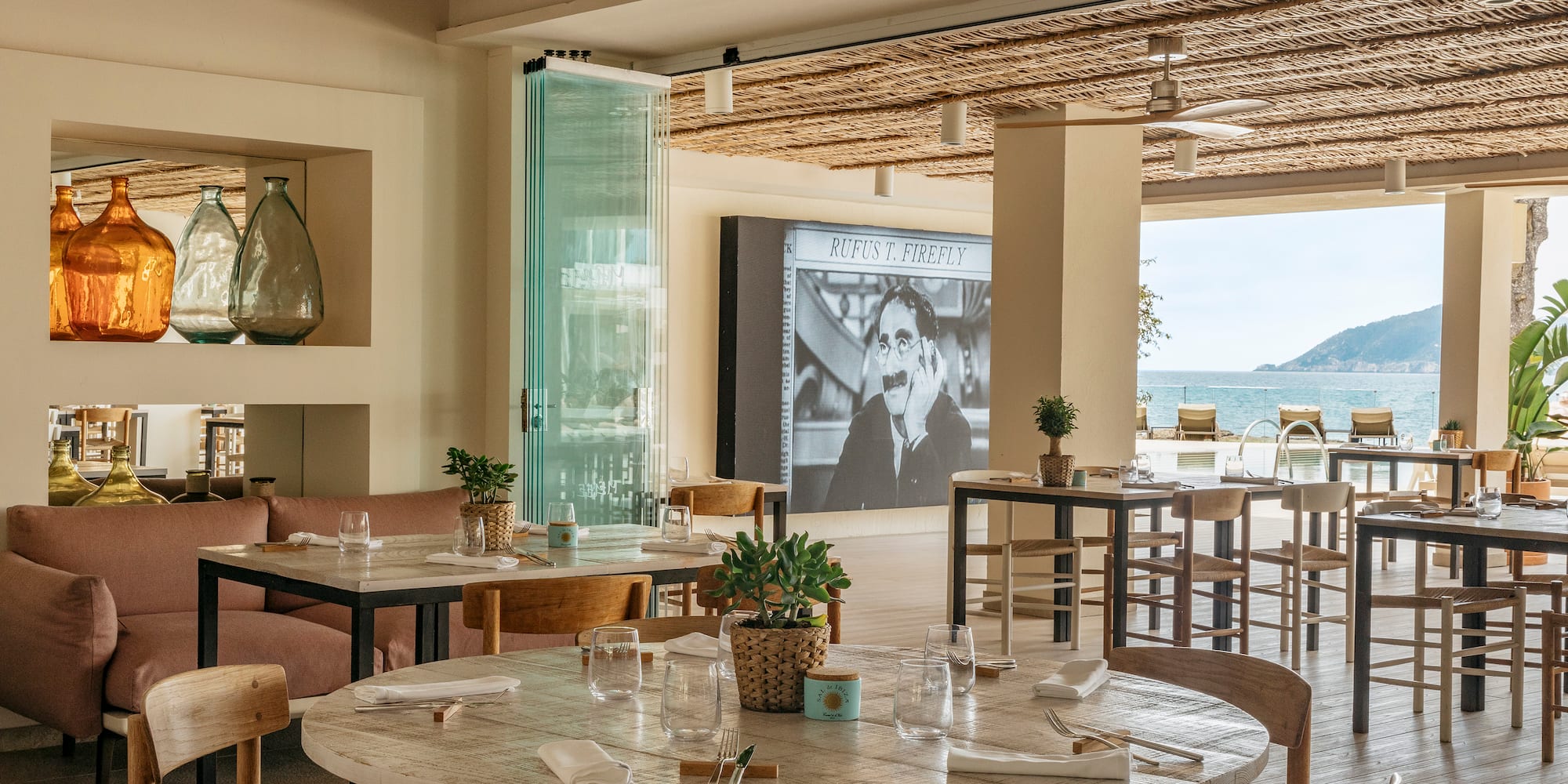 a restaurant with tables and chairs