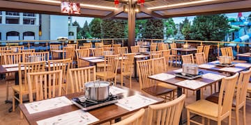 a restaurant with tables and chairs