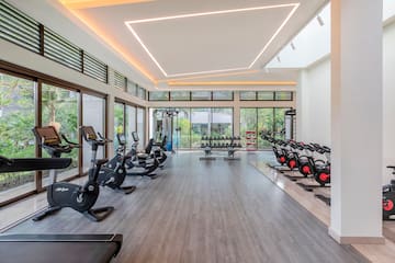 a large room with exercise bikes