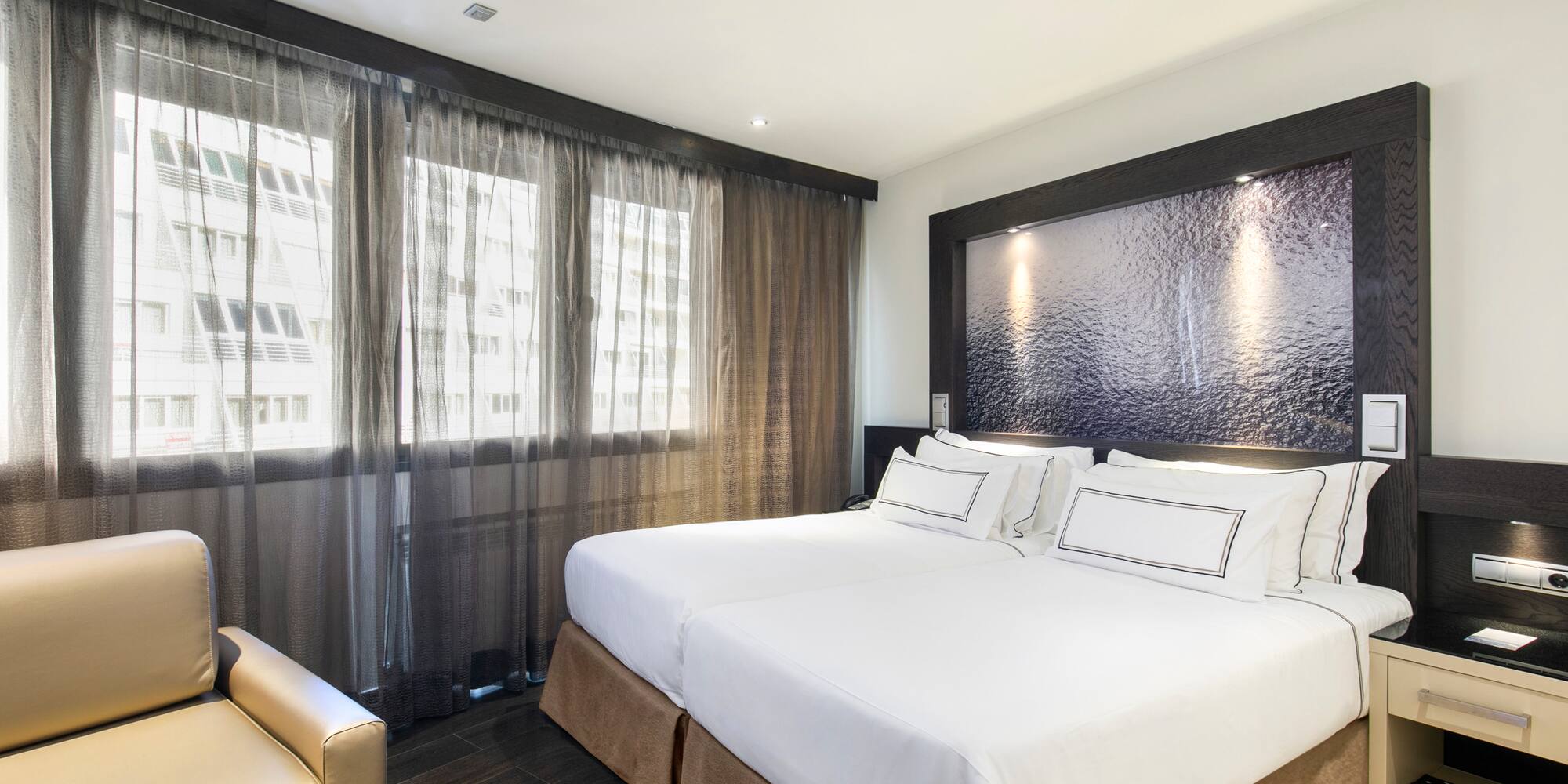 a room with a bed and a chair