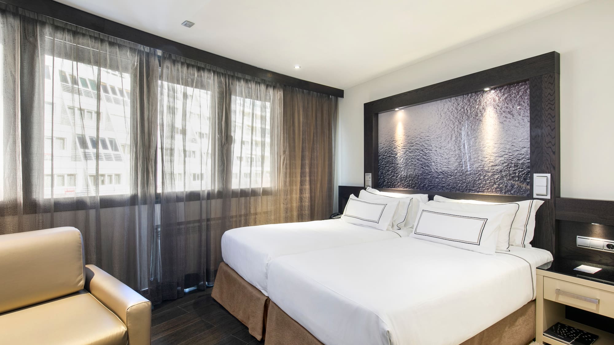 a room with a bed and a chair