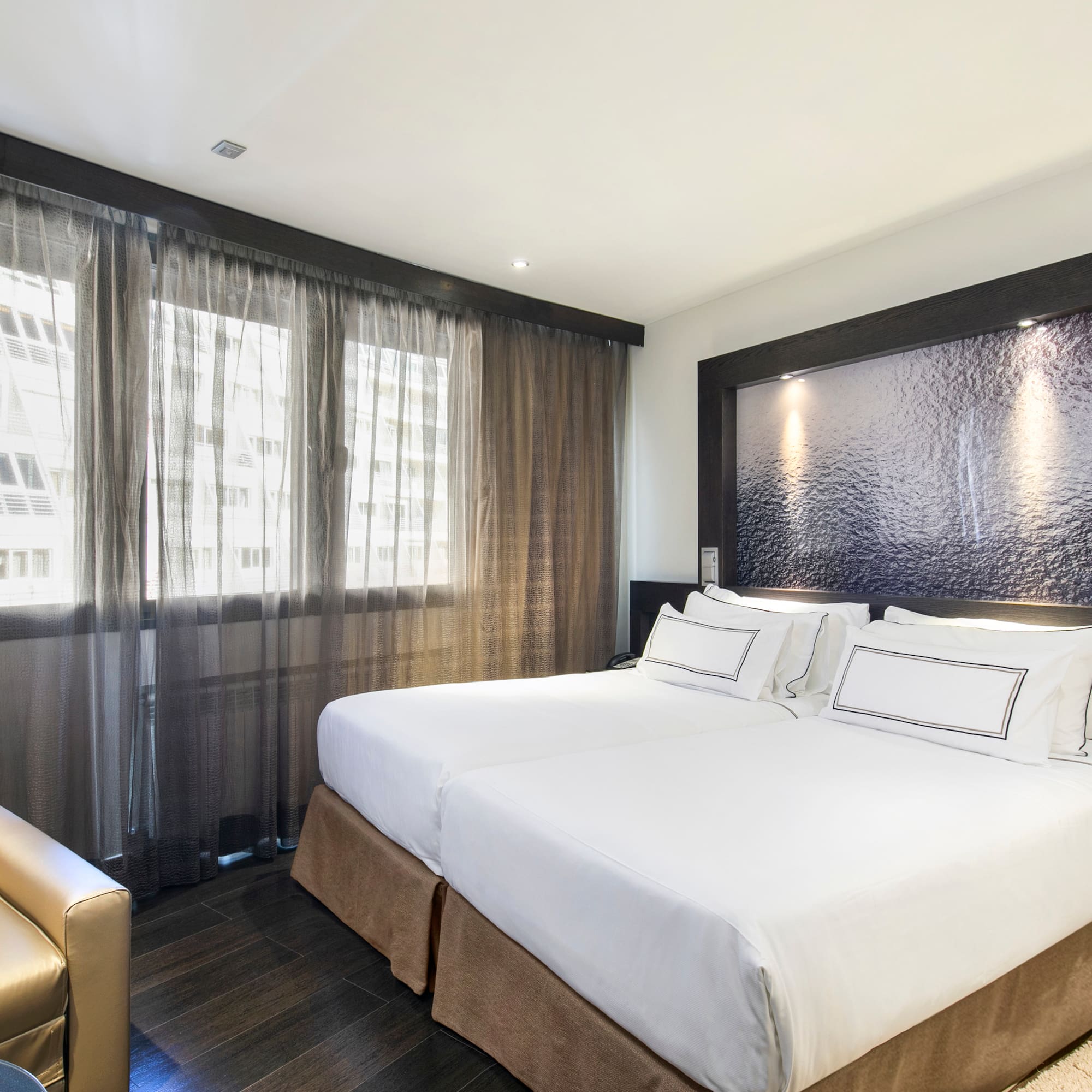 a room with a bed and a chair