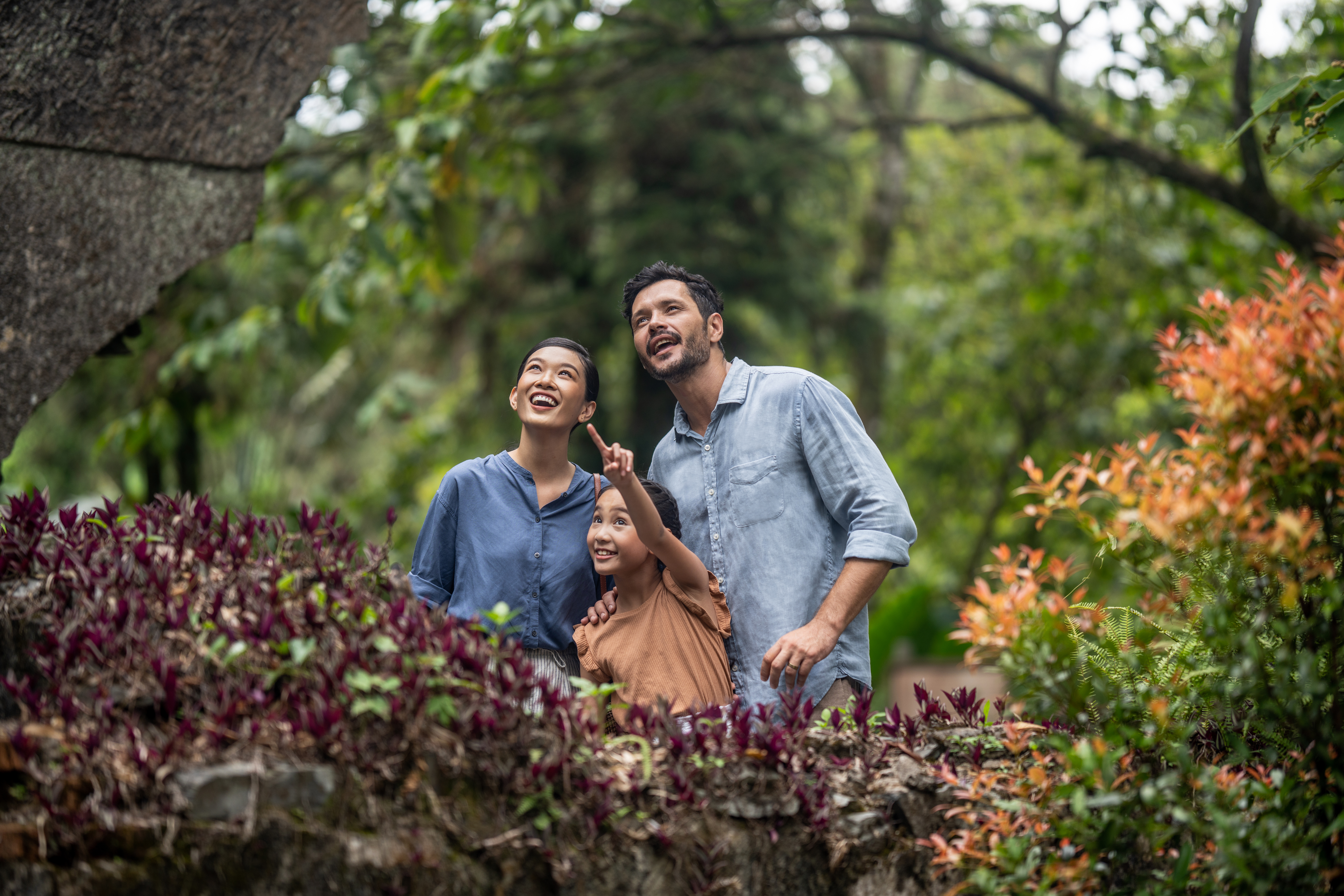 a group of people standing in a garden