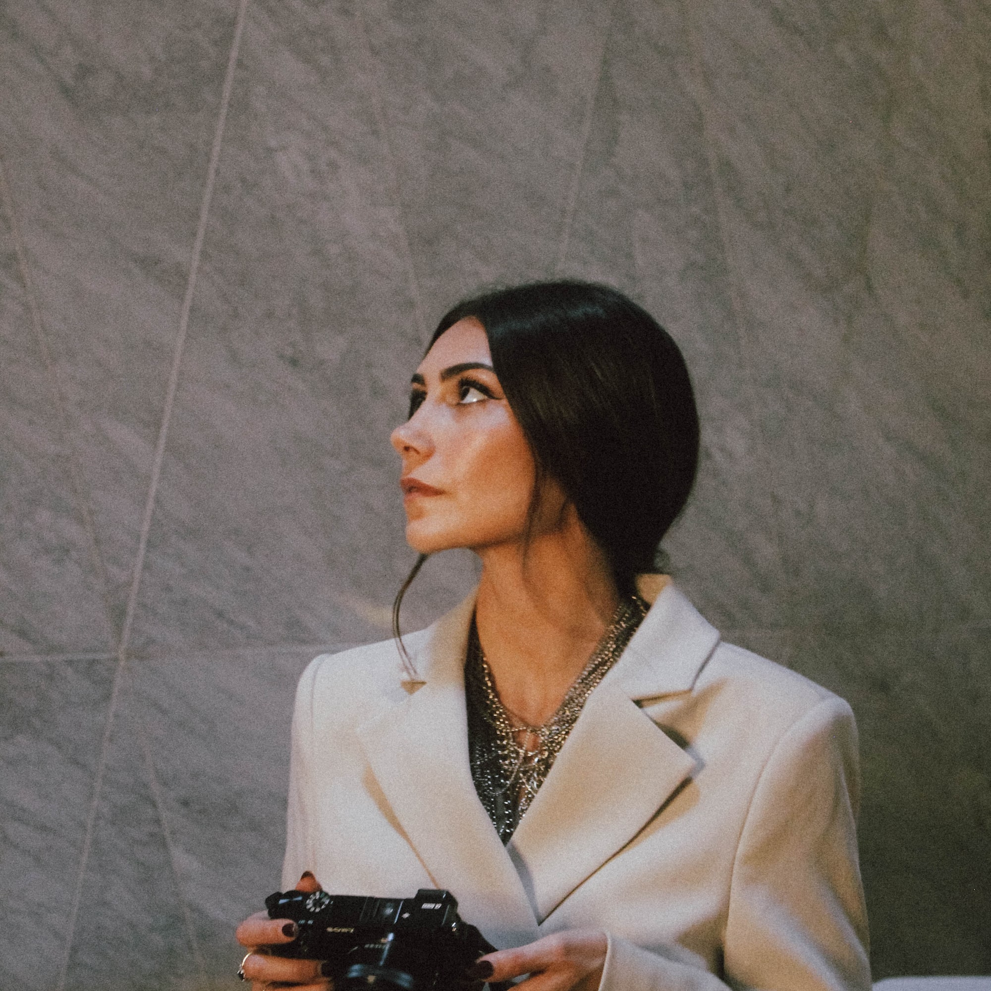 a woman holding a camera