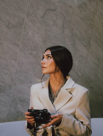 a woman holding a camera