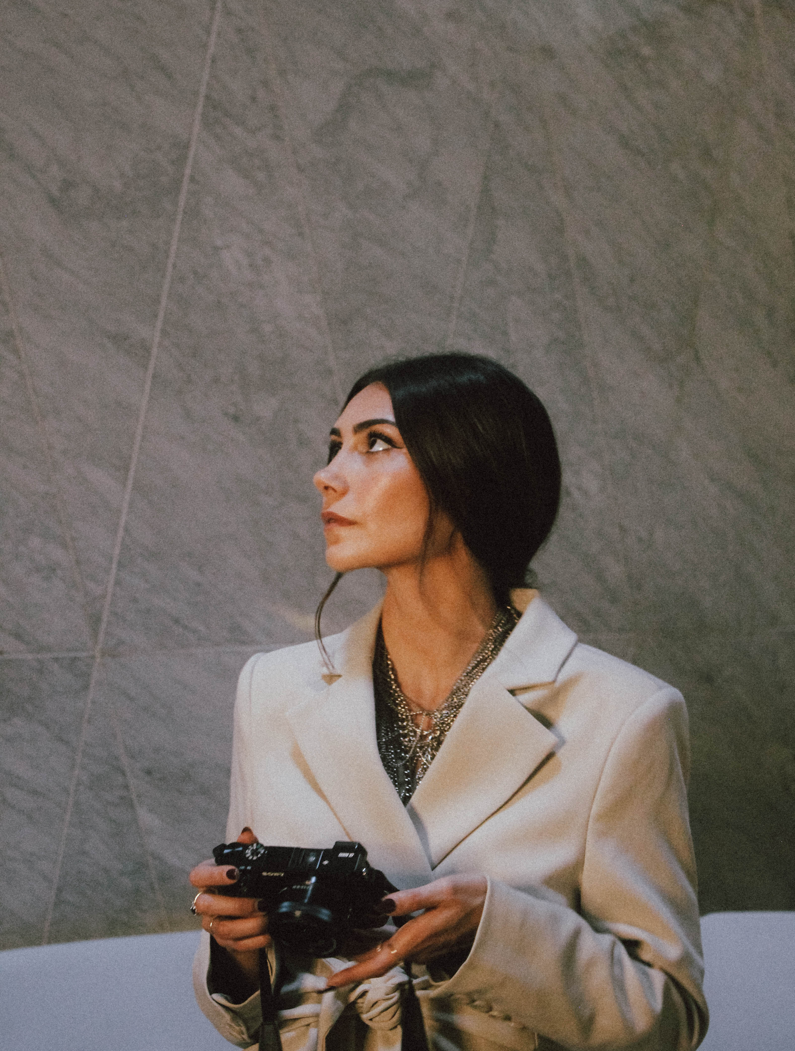 a woman holding a camera