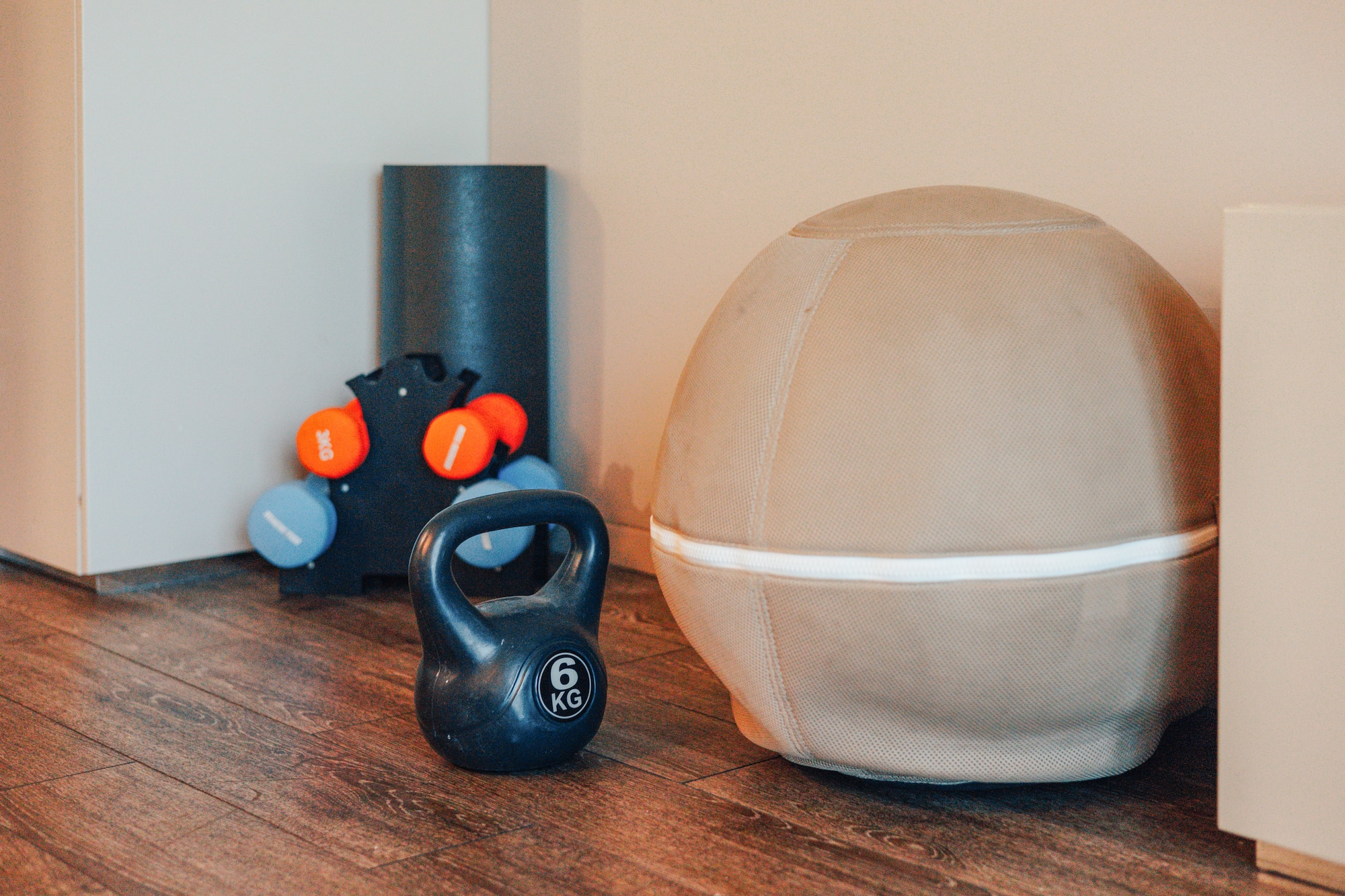 6kg kettlebell, dumbbells, stability ball, and foam roller for home workout.