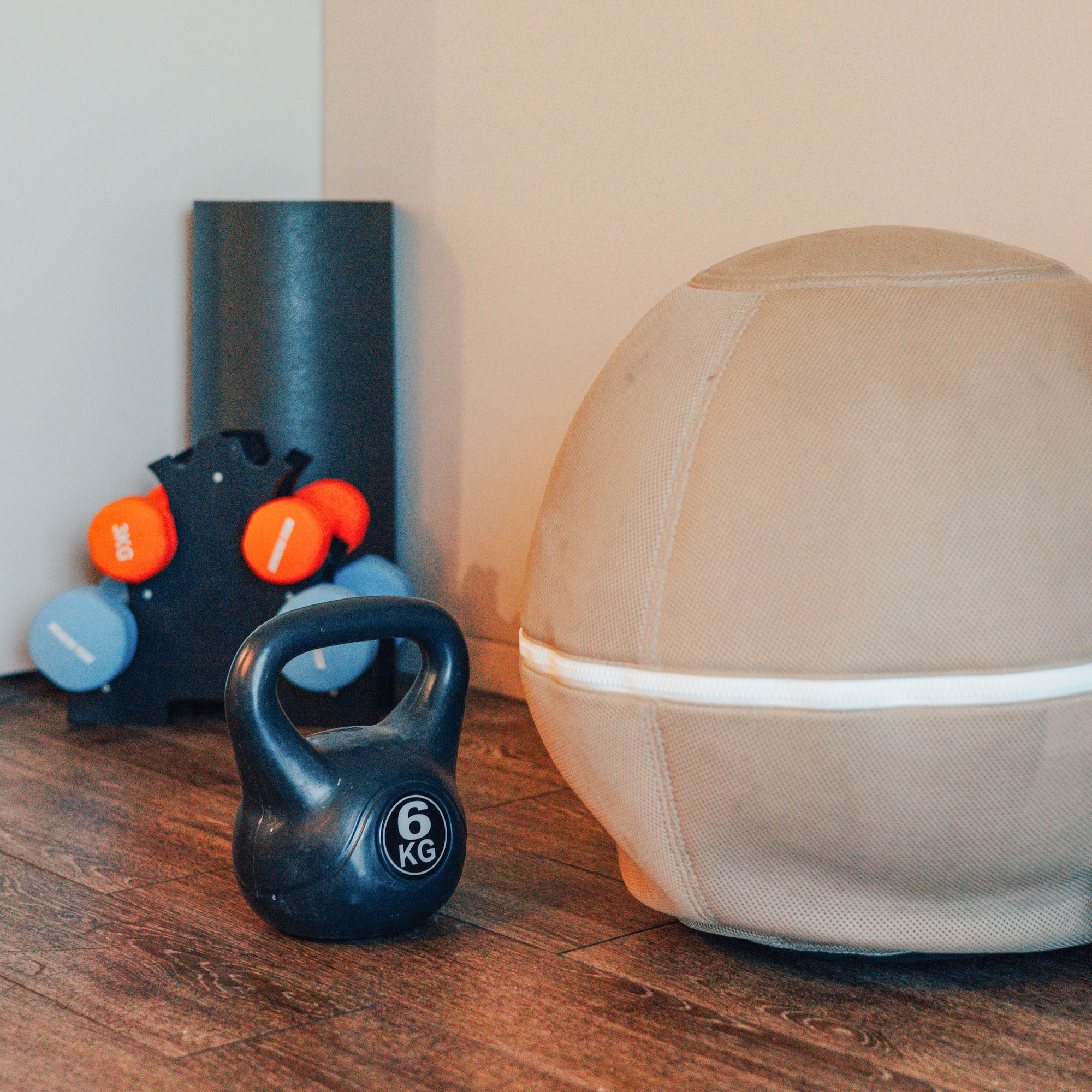 6kg kettlebell, dumbbells, stability ball, and foam roller for home workout.