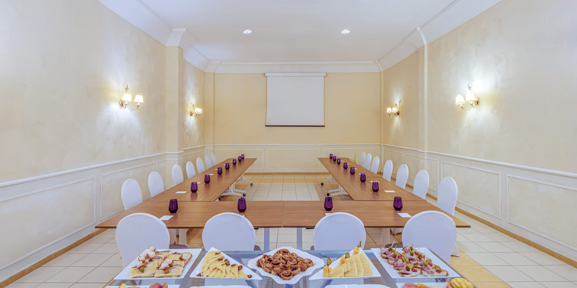 a room with a long table with food on it