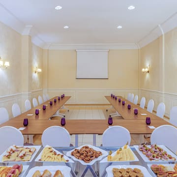 a room with a long table with food on it